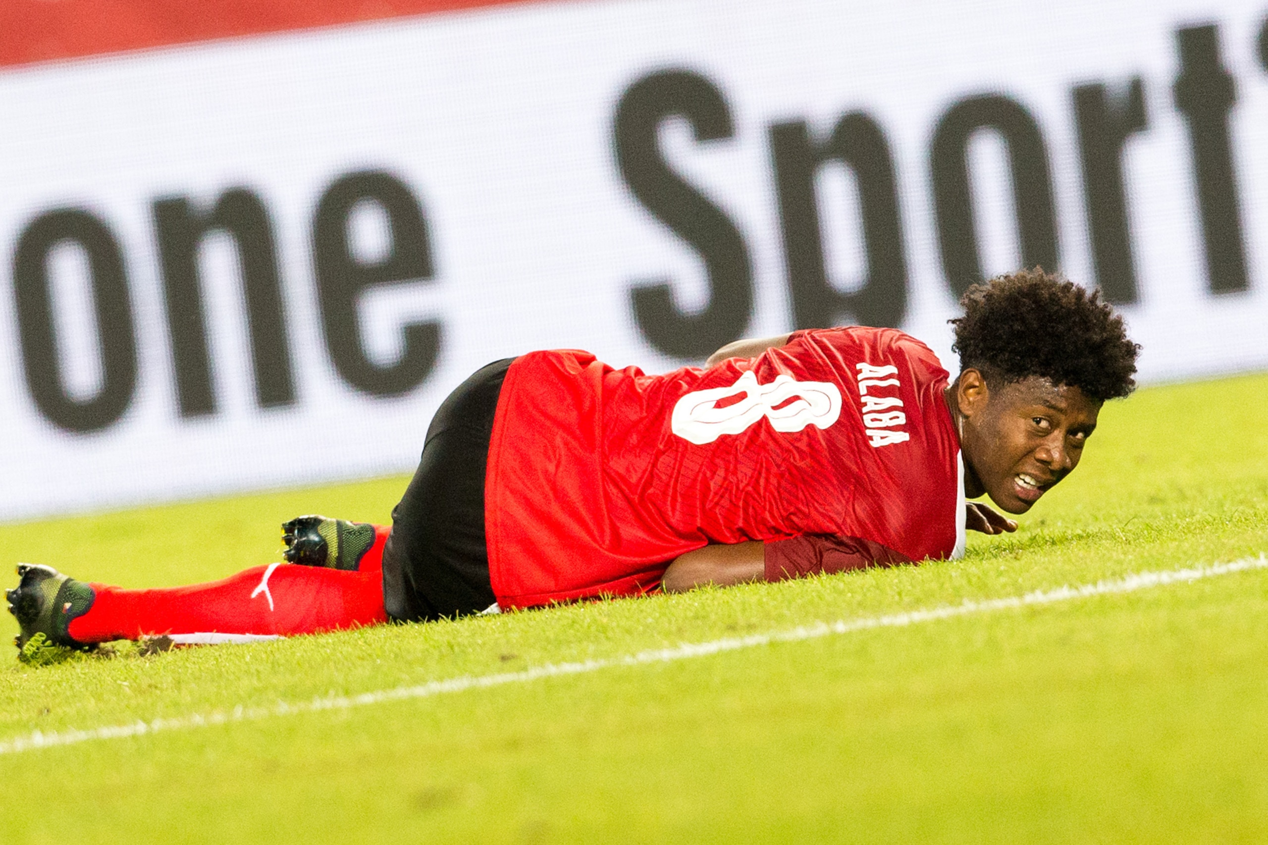 Austria's defender David Alaba lies injured on the pitch during the Group D FIFA World Cup 2018 qualification match between Austria and Georgia at the Ernst Happel Stadium in Vienna on September 5, 2017. / AFP PHOTO / APA / GEORG HOCHMUTH / Austria OUT   