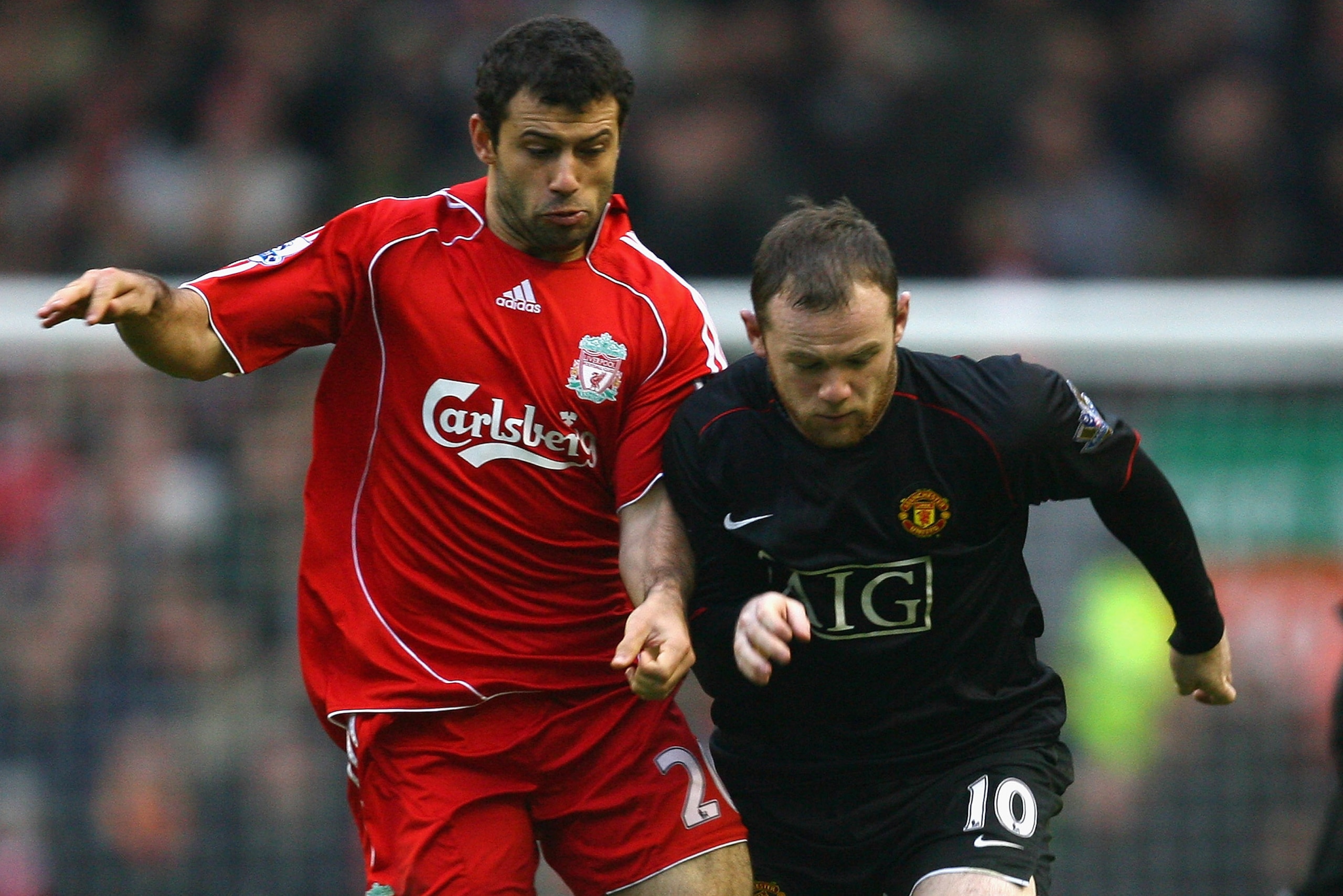 LIVERPOOL, UNITED KINGDOM - DECEMBER 16: Wayne Rooney of Manchester United battles for the ball with Javier Mascherano of Liverpool during the Barclays Premier League match between Liverpool and Manchester United at Anfield on December 16, 2007 in Liverp LIVERPOOL, UNITED KINGDOM - DECEMBER 16: Wayne Rooney of Manchester United battles for the ball with Javier Mascherano of Liverpool during the Barclays Premier League match between Liverpool and Manchester United at Anfield on December 16, 2007 in Liverp