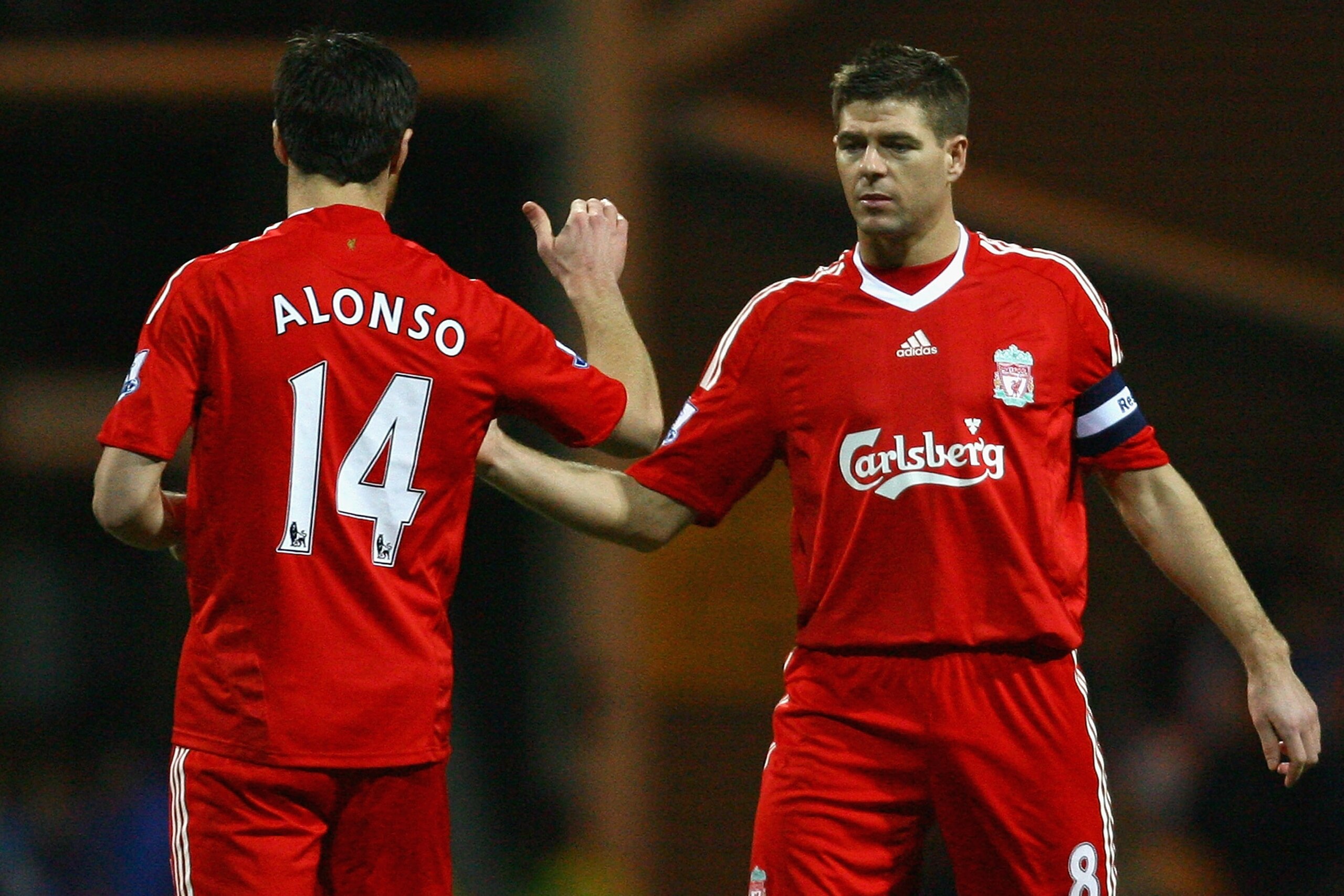 PRESTON, UNITED KINGDOM - JANUARY 03: Steven Gerrard of Liverpool shakes hands with team mate Xabi Alonso (L) prior to the FA Cup sponsored by E.ON Third Round match between Preston North End and Liverpool at Deepdale Stadium on January 3, 2009 in Presto PRESTON, UNITED KINGDOM - JANUARY 03: Steven Gerrard of Liverpool shakes hands with team mate Xabi Alonso (L) prior to the FA Cup sponsored by E.ON Third Round match between Preston North End and Liverpool at Deepdale Stadium on January 3, 2009 in Presto