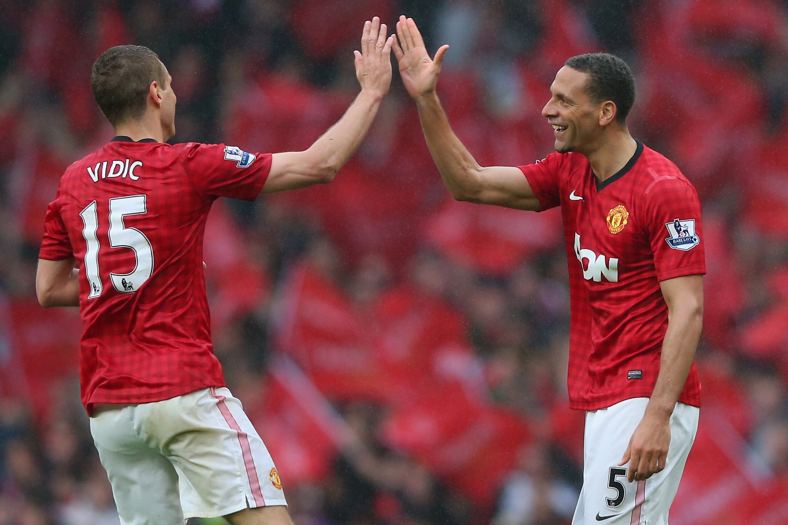 MANCHESTER, ENGLAND - MAY 12: Rio Ferdinand of Manchester United celebrates scoring the winning goal with team-mate Nemanja Vidic during the Barclays Premier League match between Manchester United and Swansea City at Old Trafford on May 12, 2013 in Manch MANCHESTER, ENGLAND - MAY 12: Rio Ferdinand of Manchester United celebrates scoring the winning goal with team-mate Nemanja Vidic during the Barclays Premier League match between Manchester United and Swansea City at Old Trafford on May 12, 2013 in Manch