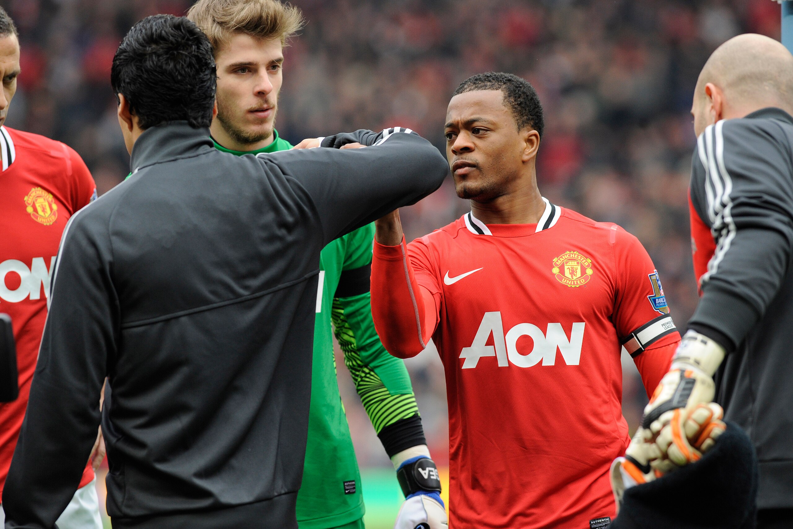 MANCHESTER, ENGLAND - FEBRUARY 11: Luis Suarez of Liverpool refuses to shake the hand of Patrice Evra of Manchester United ahead of the Barclays Premier League match between Manchester United and Liverpool at Old Trafford on February 11, 2012 in Mancheste MANCHESTER, ENGLAND - FEBRUARY 11: Luis Suarez of Liverpool refuses to shake the hand of Patrice Evra of Manchester United ahead of the Barclays Premier League match between Manchester United and Liverpool at Old Trafford on February 11, 2012 in Mancheste