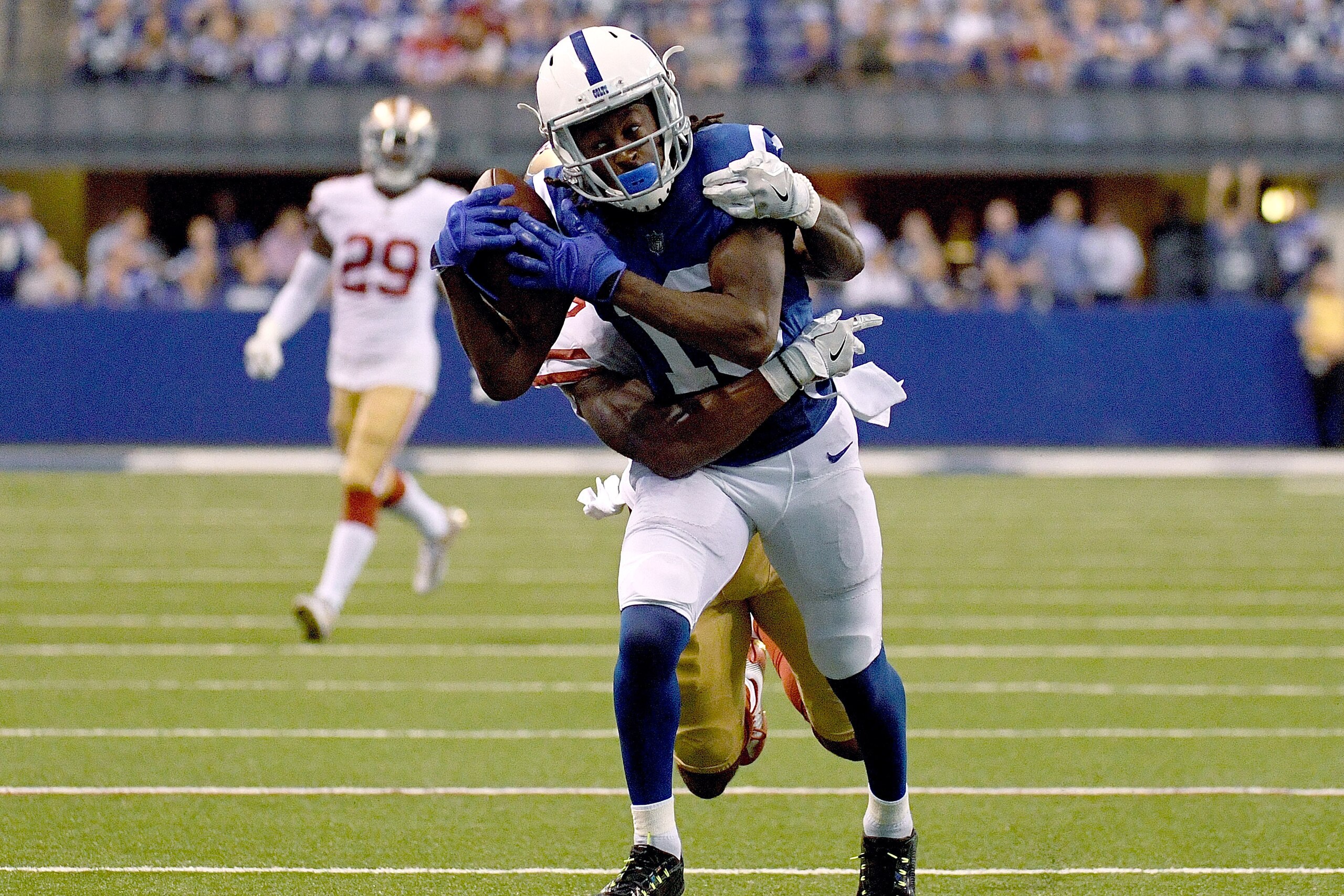 INDIANAPOLIS, IN - OCTOBER 08:  T.Y. Hilton #13 of the Indianapolis Colts catches a pass for a first down in overtime during the game between the Indianapolis Colts and the San Francisco 49ers at Lucas Oil Stadium on October 8, 2017 in Indianapolis, India