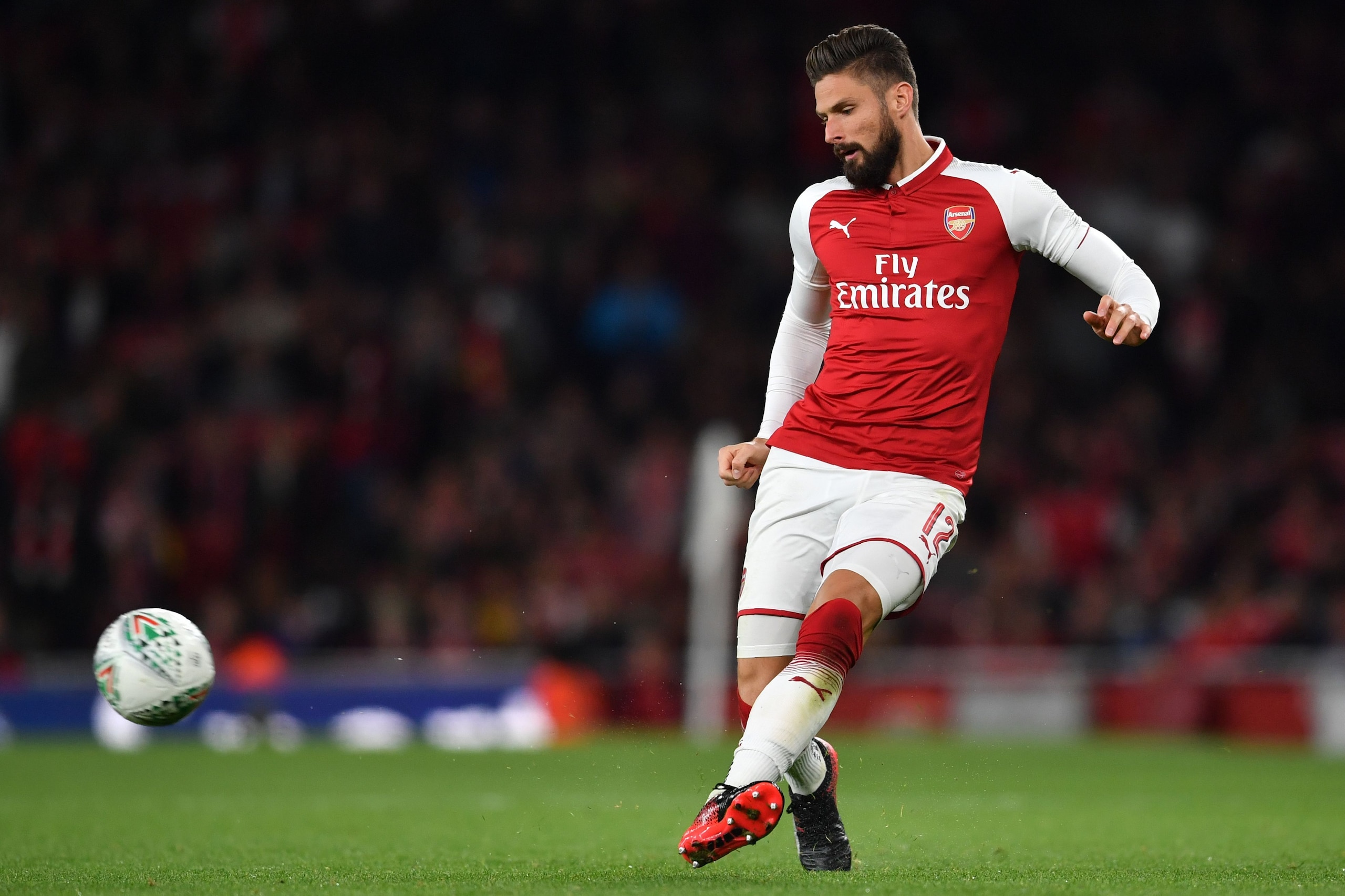 Arsenal's French striker Olivier Giroud passes the ball during the English League Cup third round football match between Arsenal and Doncaster Rovers at The Emirates Stadium in London on September 20, 2017. / AFP PHOTO / Ben STANSALL / RESTRICTED TO EDITO