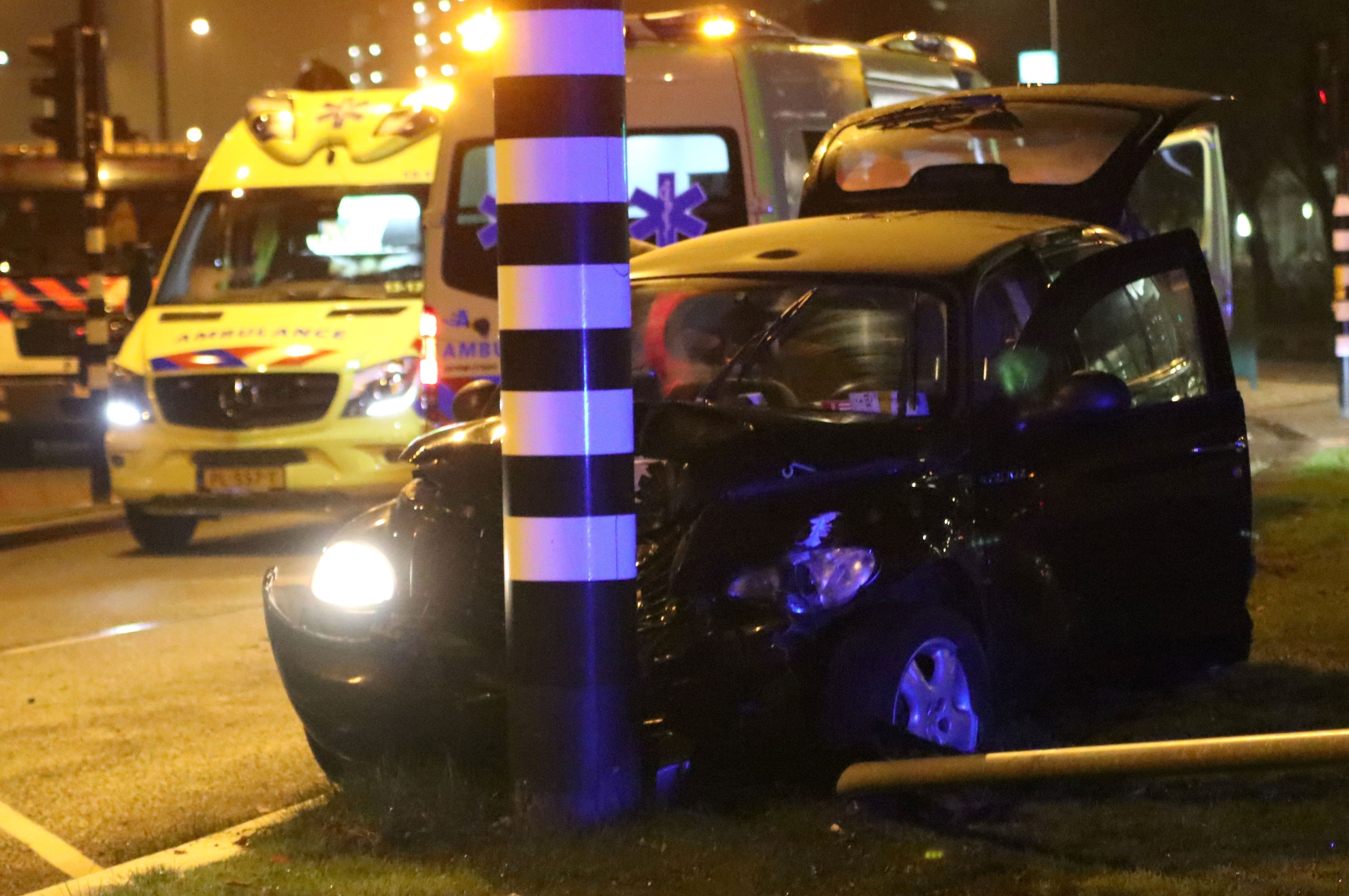 Rescuers gather on the scene of a car accident involving Manchester City's Argentine striker Sergio Aguero on September 28, 2017 in Amsterdam. 
Aguero 'sustained injuries' in a car crash in the Netherlands and is returning to Britain to be checked ahead o