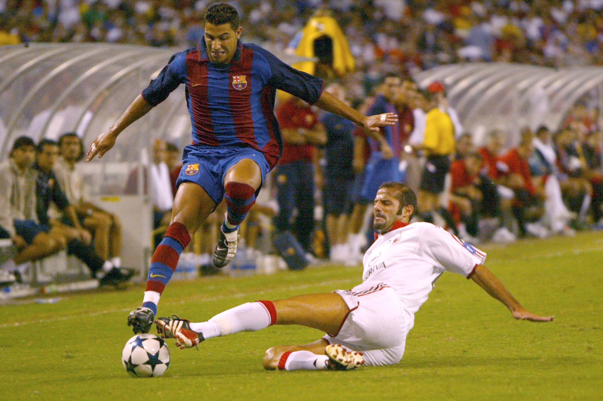 WASHINGTON D.C. - JULY 30:  Giuseppe Pancaro #26 of AC Milan steals the ball from Ricardo Quaresma #7 of Barcelona as FC Barcelona defeated AC Milan 2-0 at RFK Stadium on July 30, 2003 in Washington, DC.  (Photo by Doug Pensinger/Getty Images)