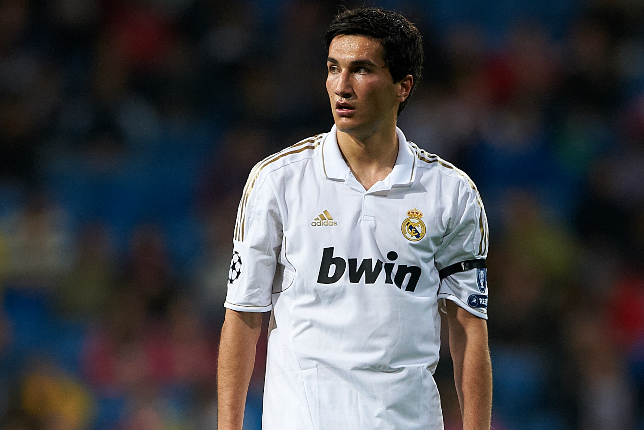 MADRID, SPAIN - APRIL 04: Nuri Sahin of Real Madrid looks on during the UEFA Champions League quarter-final second leg match between Real Madrid and APOEL FC at Bernabeu on April 4, 2012 in Madrid, Spain.  (Photo by Manuel Queimadelos Alonso/Getty Images)