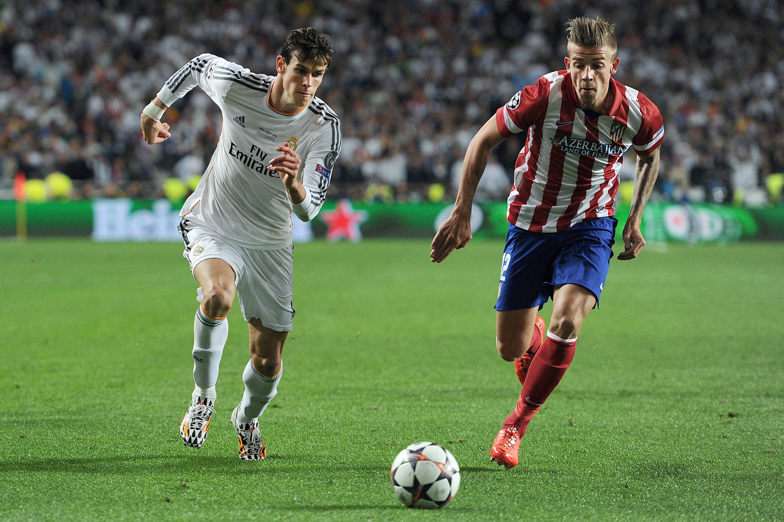 LISBON, PORTUGAL - MAY 24: Gareth Bale of Real Madrid in action with of Toby Alderweireld of Atletico de Madrid during the UEFA Champions League Final match between Real Madrid and Atletico de Madrid at Estadio da Luz on May 24, 2014 in Lisbon, Portugal. 