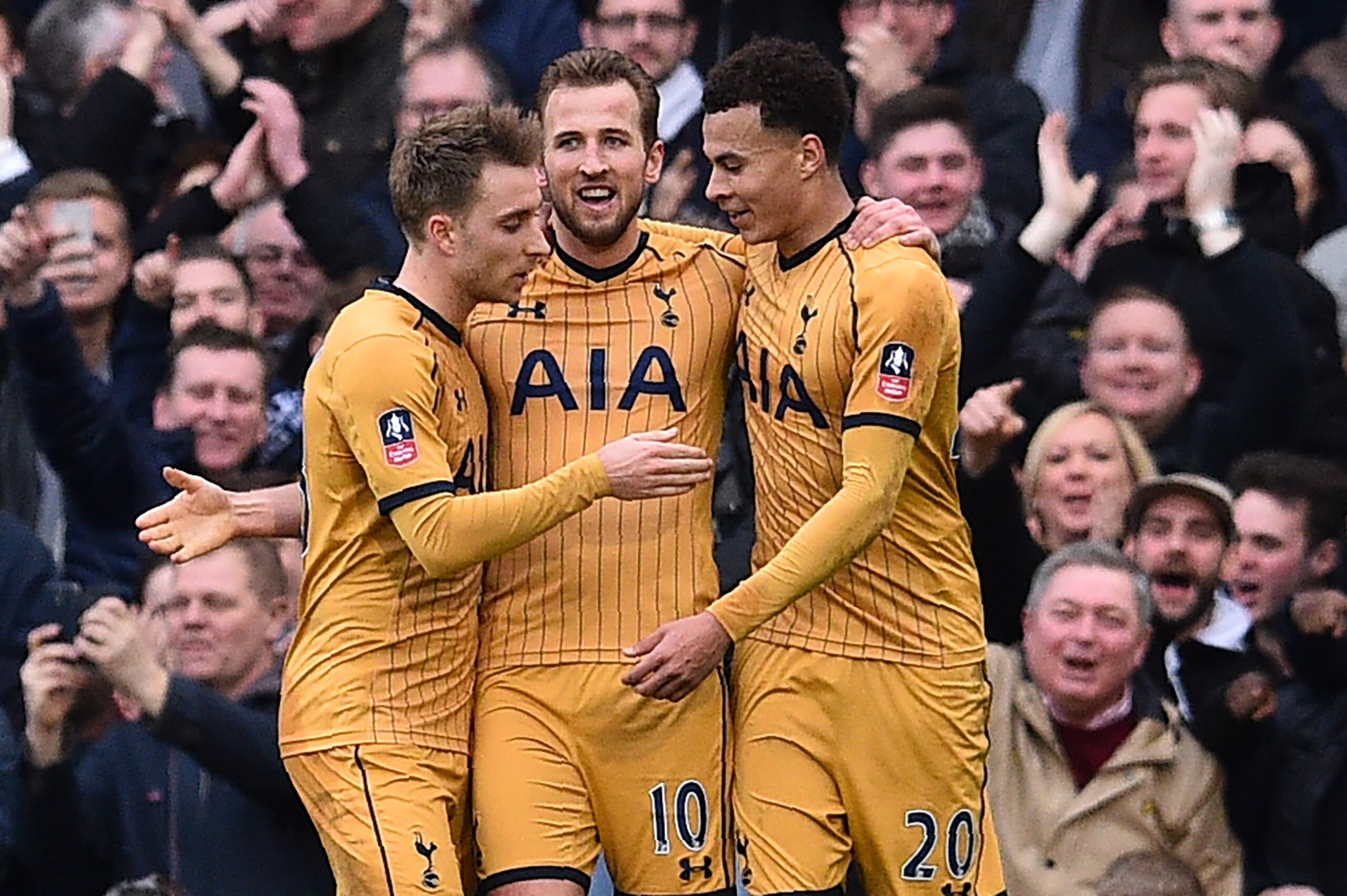 Tottenham Hotspur's English striker Harry Kane (C) celebrates after scoring a hat-trick with Tottenham Hotspur's Danish midfielder Christian Eriksen (L) and Tottenham Hotspur's English midfielder Dele Alli during the English FA Cup fifth round football ma