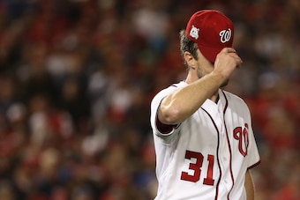 WASHINGTON, DC - OCTOBER 12: Max Scherzer #31 of the Washington Nationals reacts after giving up a two run double to Addison Russell #27 of the Chicago Cubs during the fifth inning in game five of the National League Division Series at Nationals Park on O