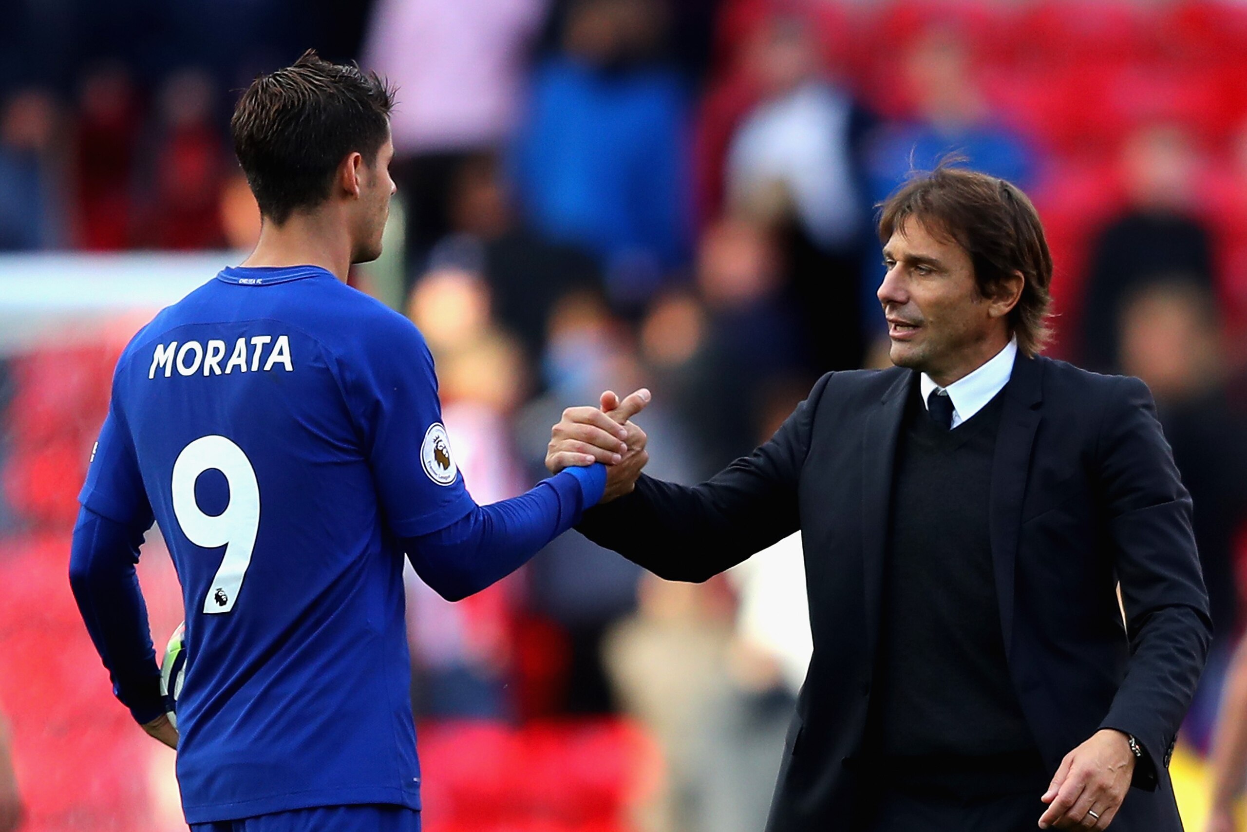 STOKE ON TRENT, ENGLAND - SEPTEMBER 23:  Alvaro Morata of Chelsea is congratulated his team's 4-0 victory and his hat trick by manager Antonio Conte after the Premier League match between Stoke City and Chelsea at Bet365 Stadium on September 23, 2017 in S