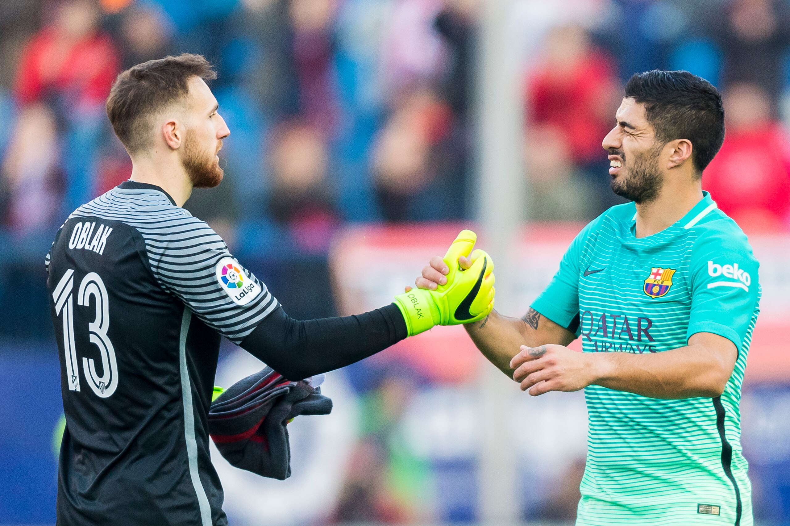 MADRID, SPAIN - FEBRUARY 26: Goalkeeper Jan Oblak (l) of Atletico de Madrid shakes hands with Luis Suarez of FC Barcelona during their La Liga match between Atletico de Madrid and FC Barcelona at the Santiago Bernabeu Stadium on 26 February 2017 in Madrid