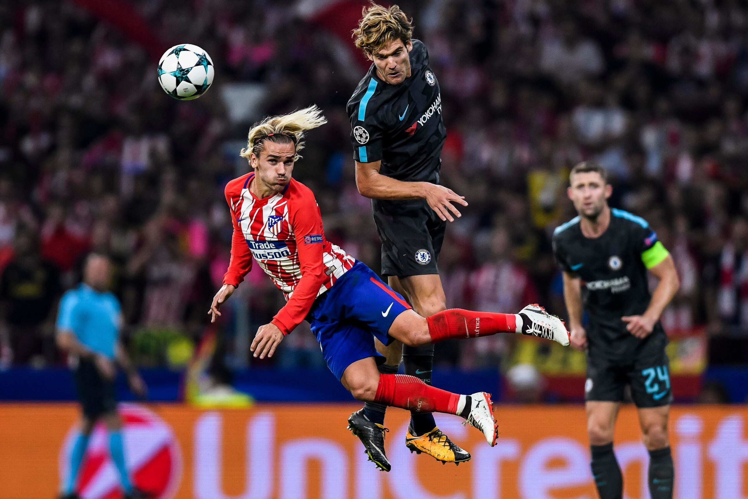 MADRID, SPAIN - SEPTEMBER 27: Antoine Griezmann (l) of Atletico de Madrid battles for the ball with Marcos Alonso of Chelsea FC during the UEFA Champions League 2017-18 match between Atletico de Madrid and Chelsea FC at the Wanda Metropolitano on 27 Septe