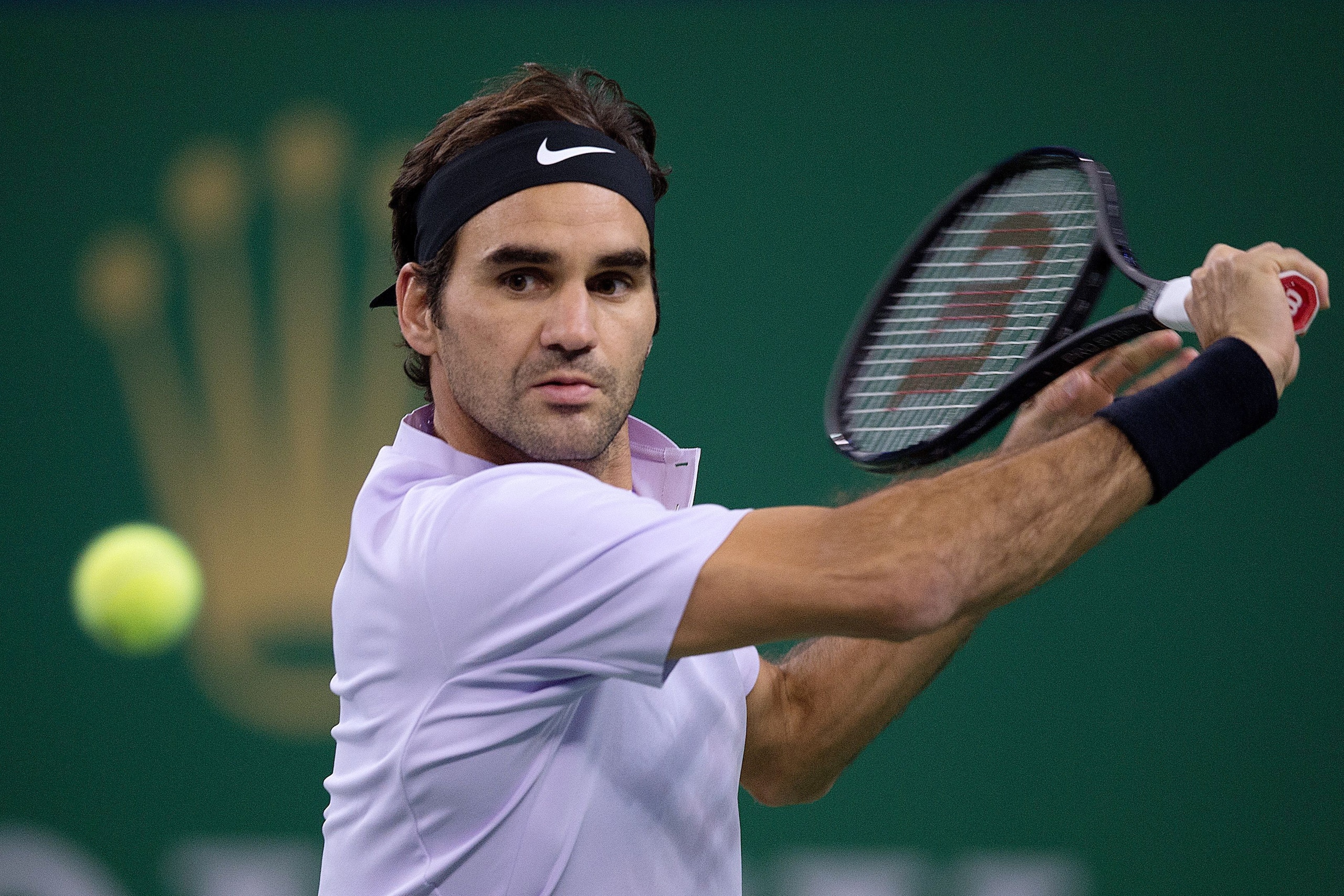 Roger Federer of Switzerland hits a return during his men's quarterfinals singles match against Richard Gasquet of France at the Shanghai Masters tennis tournament in Shanghai on October 13, 2017. / AFP PHOTO / NICOLAS ASFOURI        (Photo credit should 
