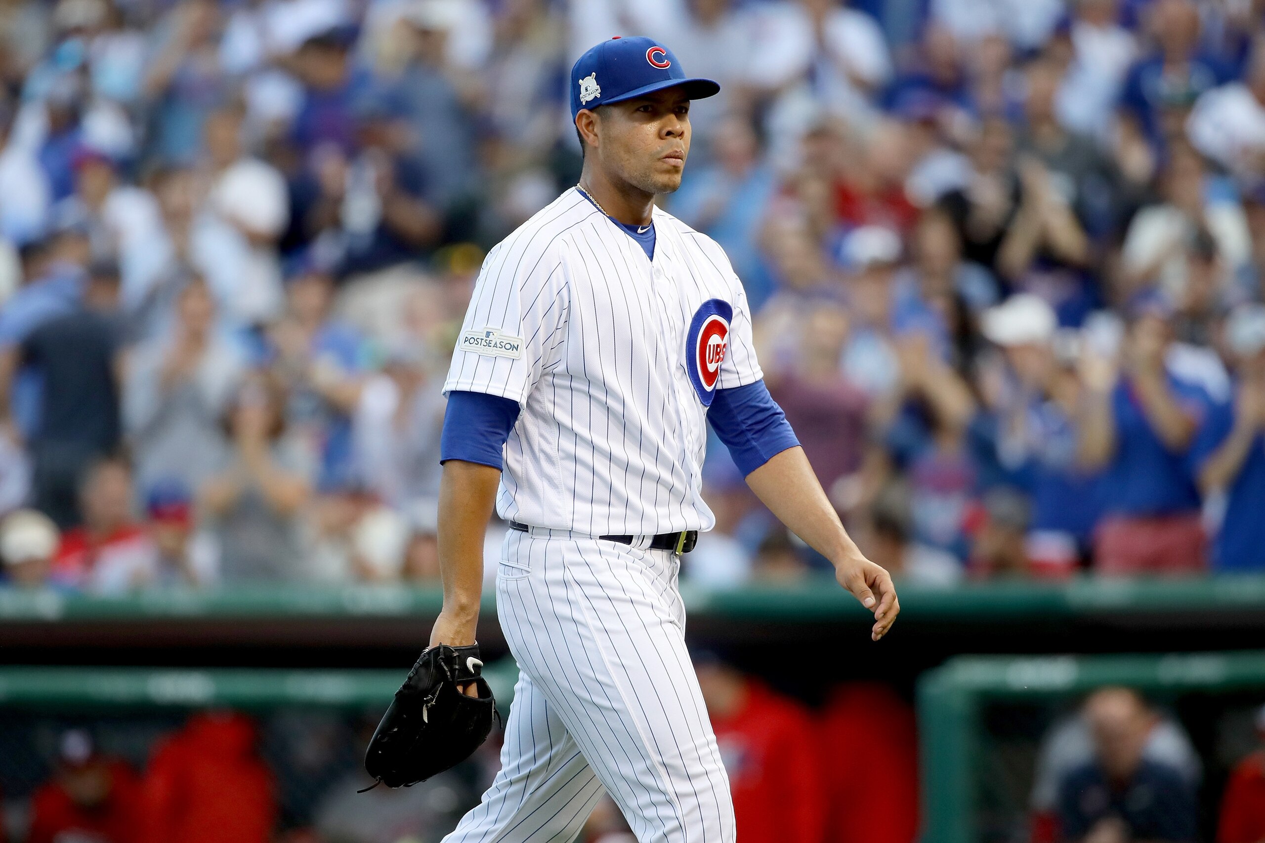 CHICAGO, IL - OCTOBER 09:  Jose Quintana #62 of the Chicago Cubs walks off the field in the first inning against the Washington Nationals during game three of the National League Division Series at Wrigley Field on October 9, 2017 in Chicago, Illinois. (P