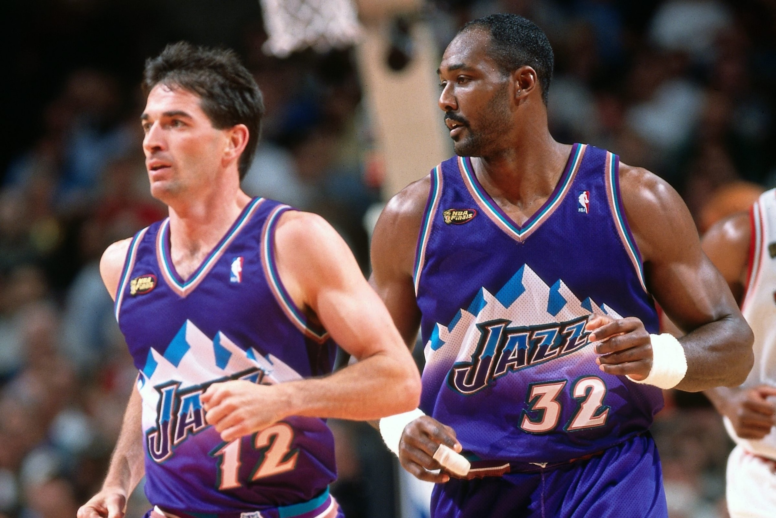 CHICAGO - JUNE 10: John Stockton #12 and Karl Malone #32 of the Utah Jazz run up court during Game Four of the 1998 NBA Finals against the Chicago Bulls played on June 10, 1998 at the United Center in Chicago, Illinois. Chicago defeated Utah 86-82 and w CHICAGO - JUNE 10: John Stockton #12 and Karl Malone #32 of the Utah Jazz run up court during Game Four of the 1998 NBA Finals against the Chicago Bulls played on June 10, 1998 at the United Center in Chicago, Illinois. Chicago defeated Utah 86-82 and w