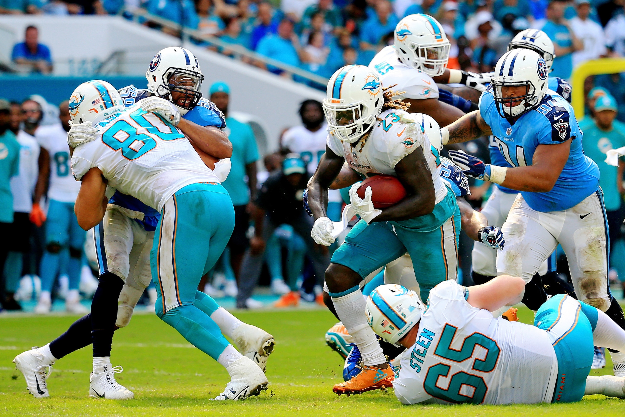 MIAMI GARDENS, FL - OCTOBER 08: Jay Ajayi #23 of the Miami Dolphins rushes against Tennessee Titans on October 8, 2017 at Hard Rock Stadium in Miami Gardens, Florida.  (Photo by Chris Trotman/Getty Images)