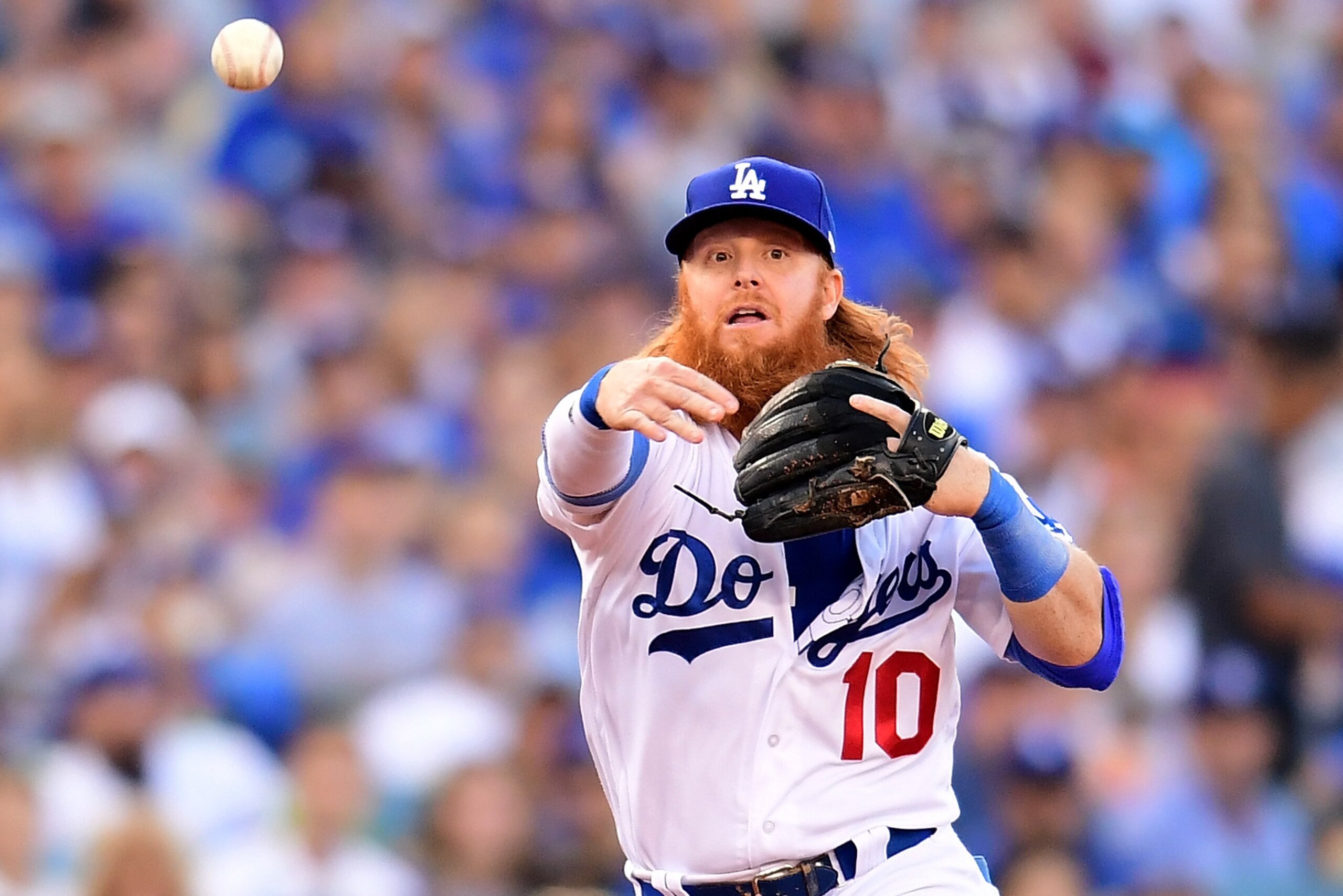 LOS ANGELES, CA - OCTOBER 14:  Justin Turner #10 of the Los Angeles Dodgers throws out Addison Russell #27 of the Chicago Cubs during the second inning in Game One of the National League Championship Series at Dodger Stadium on October 14, 2017 in Los Ang
