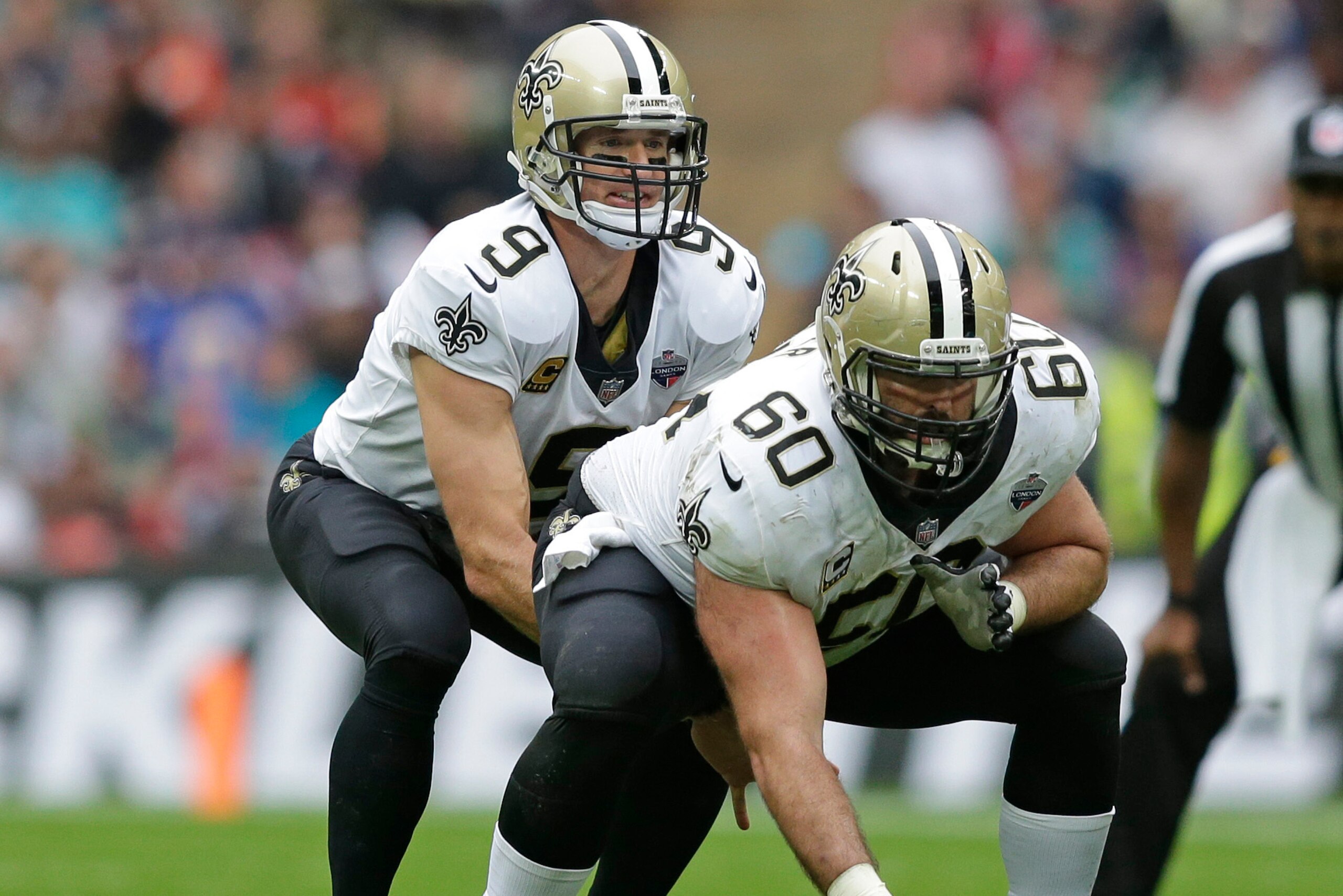 LONDON, ENGLAND - OCTOBER 01: Drew Brees (l) and Max Unger of the New Orleans Saints during the NFL game between the Miami Dolphins and the New Orleans Saints at Wembley Stadium on October 1, 2017 in London, England. (Photo by Henry Browne/Getty Images)