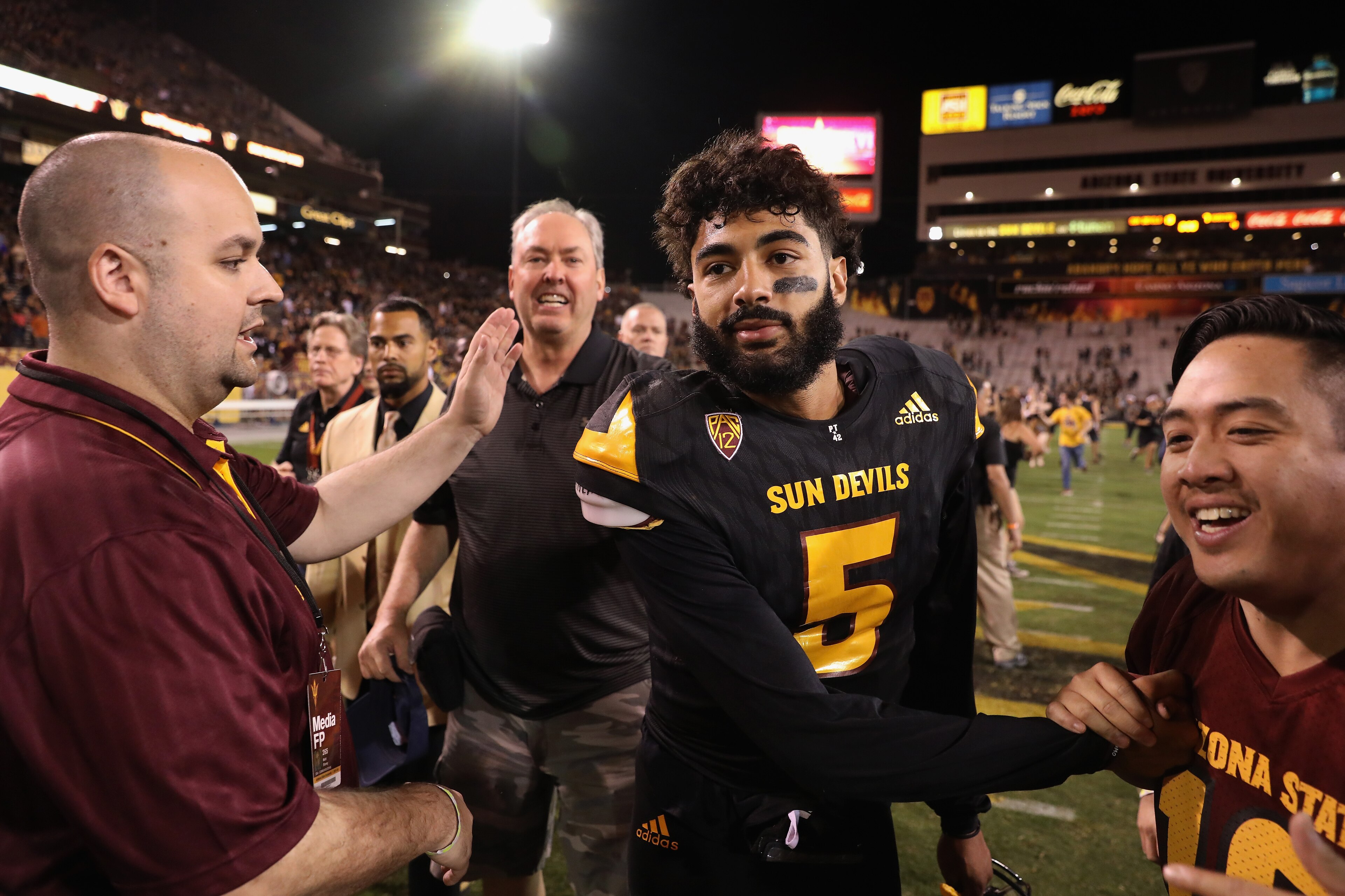 TEMPE, AZ - OCTOBER 14:  Quarterback Manny Wilkins #5 of the Arizona State Sun Devils is congratulted by fans after defeating the Washington Huskies in the college football game at Sun Devil Stadium on October 14, 2017 in Tempe, Arizona. The Sun Devils de