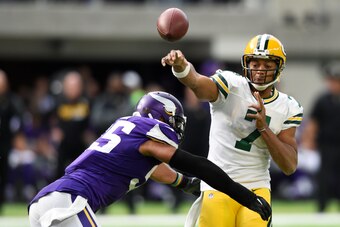 MINNEAPOLIS, MN - OCTOBER 15: Brett Hundley #7 of the Green Bay Packers throws the ball before being hit by Anthony Barr #55 of the Minnesota Vikings during the second quarter of the game on October 15, 2017 at US Bank Stadium in Minneapolis, Minnesota. (