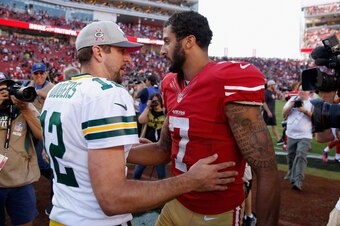 SANTA CLARA, CA - OCTOBER 04:  Colin Kaepernick #7 of the San Francisco 49ers talks with Aaron Rodgers #12 of the Green Bay Packers after their game at Levi's Stadium on October 4, 2015 in Santa Clara, California.  (Photo by Ezra Shaw/Getty Images)