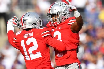 COLUMBUS, OH - OCTOBER 29:  Denzel Ward #12 of the Ohio State Buckeyes celebrates with Damon Arnette #3 of the Ohio State Buckeyes after Arnette intercepted a pass in the first quarter against the Northwestern Wildcats at Ohio Stadium on October 29, 2016 