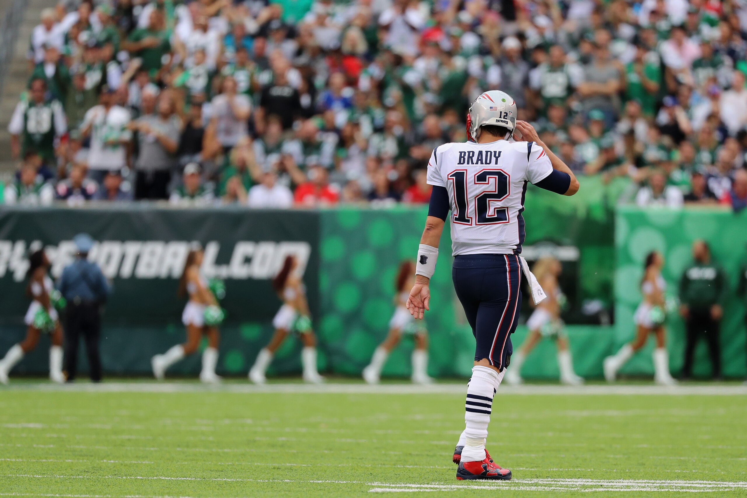 EAST RUTHERFORD, NJ - OCTOBER 15: Quarterback Tom Brady #12 of the New England Patriots looks on against the New York Jets during the second quarter of their game at MetLife Stadium on October 15, 2017 in East Rutherford, New Jersey.  The New England Patr