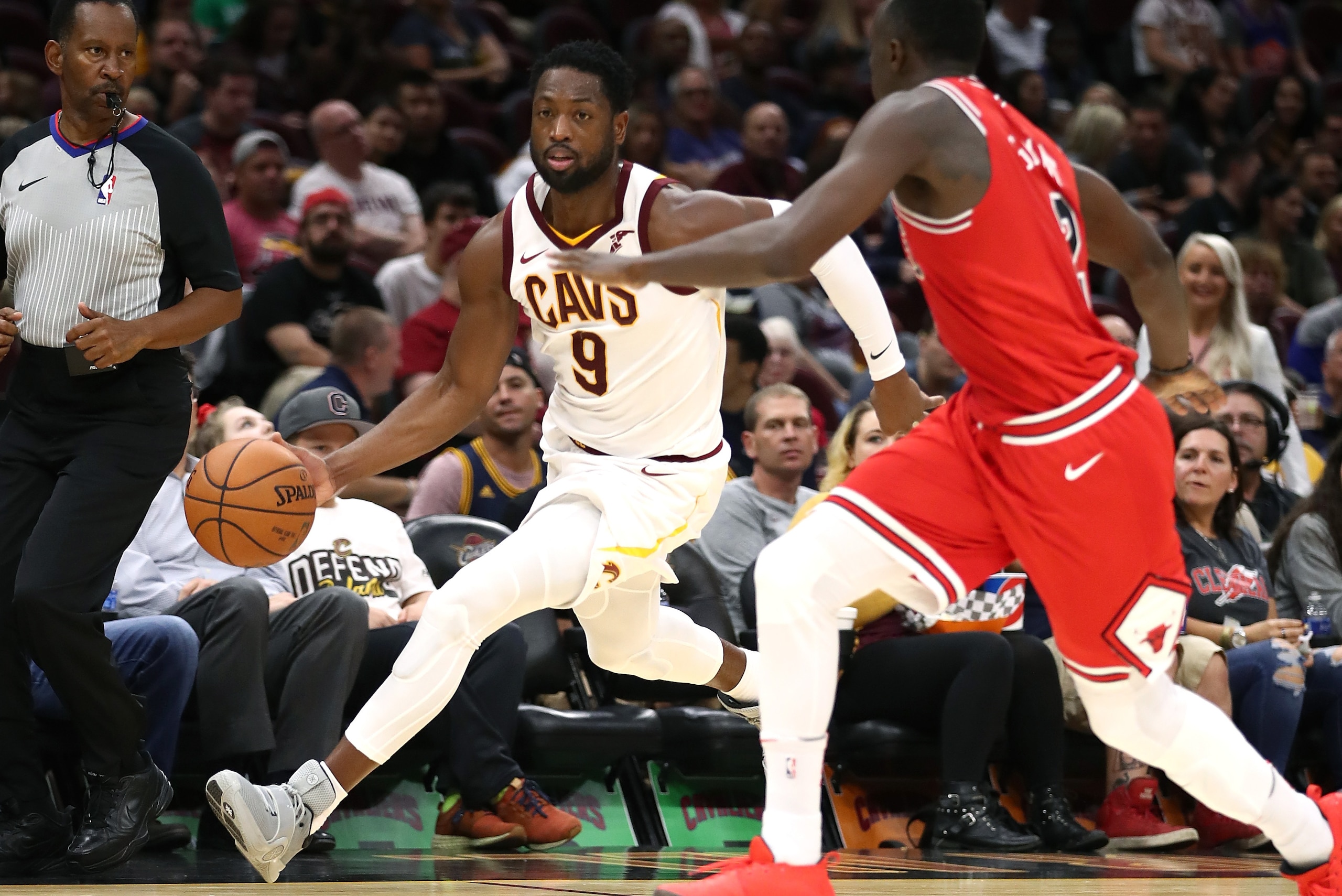 CLEVELAND, OH - OCTOBER 10: Dwyane Wade #9 of the Cleveland Cavaliers tries to drive around Jerian Grant #2 of the Chicago Bulls in the second half during a pre season game at Quicken Loans Arena on October 10, 2017 in Cleveland, Ohio. Chicago won the ga CLEVELAND, OH - OCTOBER 10: Dwyane Wade #9 of the Cleveland Cavaliers tries to drive around Jerian Grant #2 of the Chicago Bulls in the second half during a pre season game at Quicken Loans Arena on October 10, 2017 in Cleveland, Ohio. Chicago won the ga
