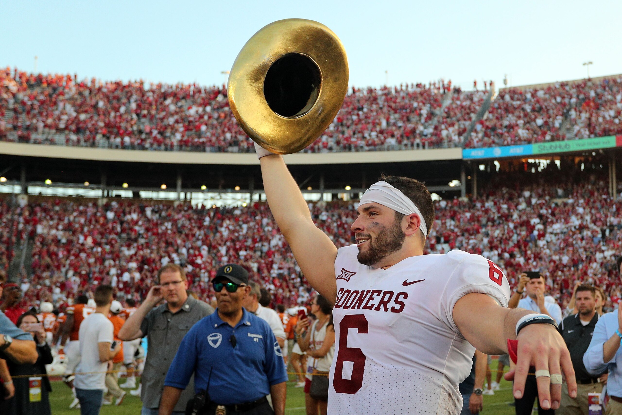 DALLAS, TX - OCTOBER 14:  Baker Mayfield #6 of the Oklahoma Sooners waves the Golden Hat Trophy after the 29-24 win over the Texas Longhorns at Cotton Bowl on October 14, 2017 in Dallas, Texas.  (Photo by Richard W. Rodriguez/Getty Images)