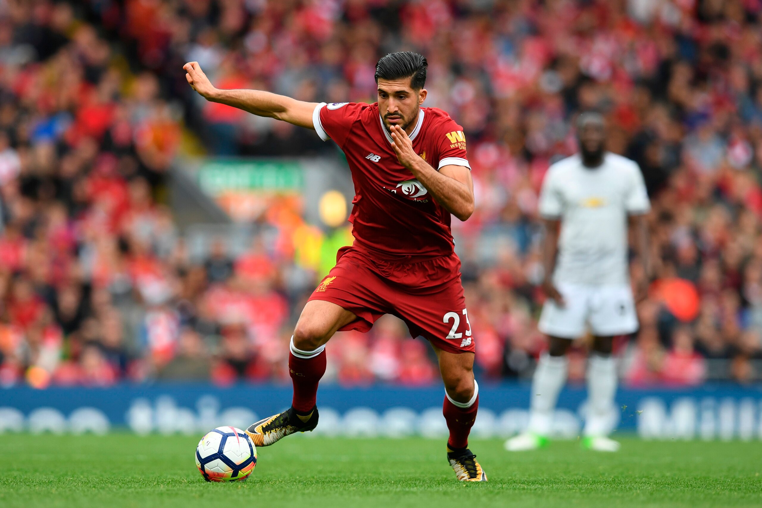 Liverpool's German midfielder Emre Can runs with the ball during the English Premier League football match between Liverpool and Manchester United at Anfield in Liverpool, north west England on October 14, 2017. / AFP PHOTO / Paul ELLIS / RESTRICTED TO ED