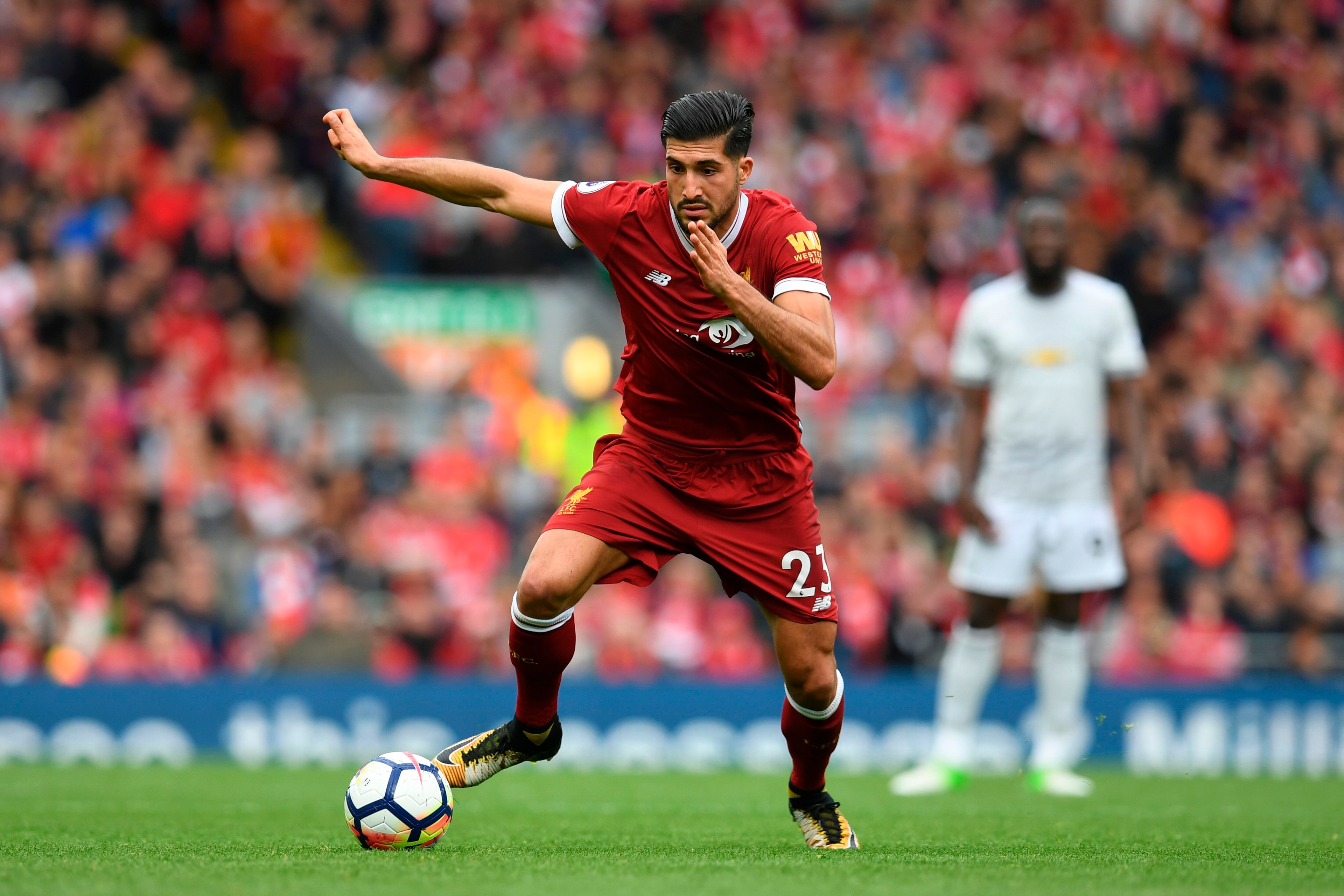 Liverpool's German midfielder Emre Can runs with the ball during the English Premier League football match between Liverpool and Manchester United at Anfield in Liverpool, north west England on October 14, 2017. / AFP PHOTO / Paul ELLIS / RESTRICTED TO ED