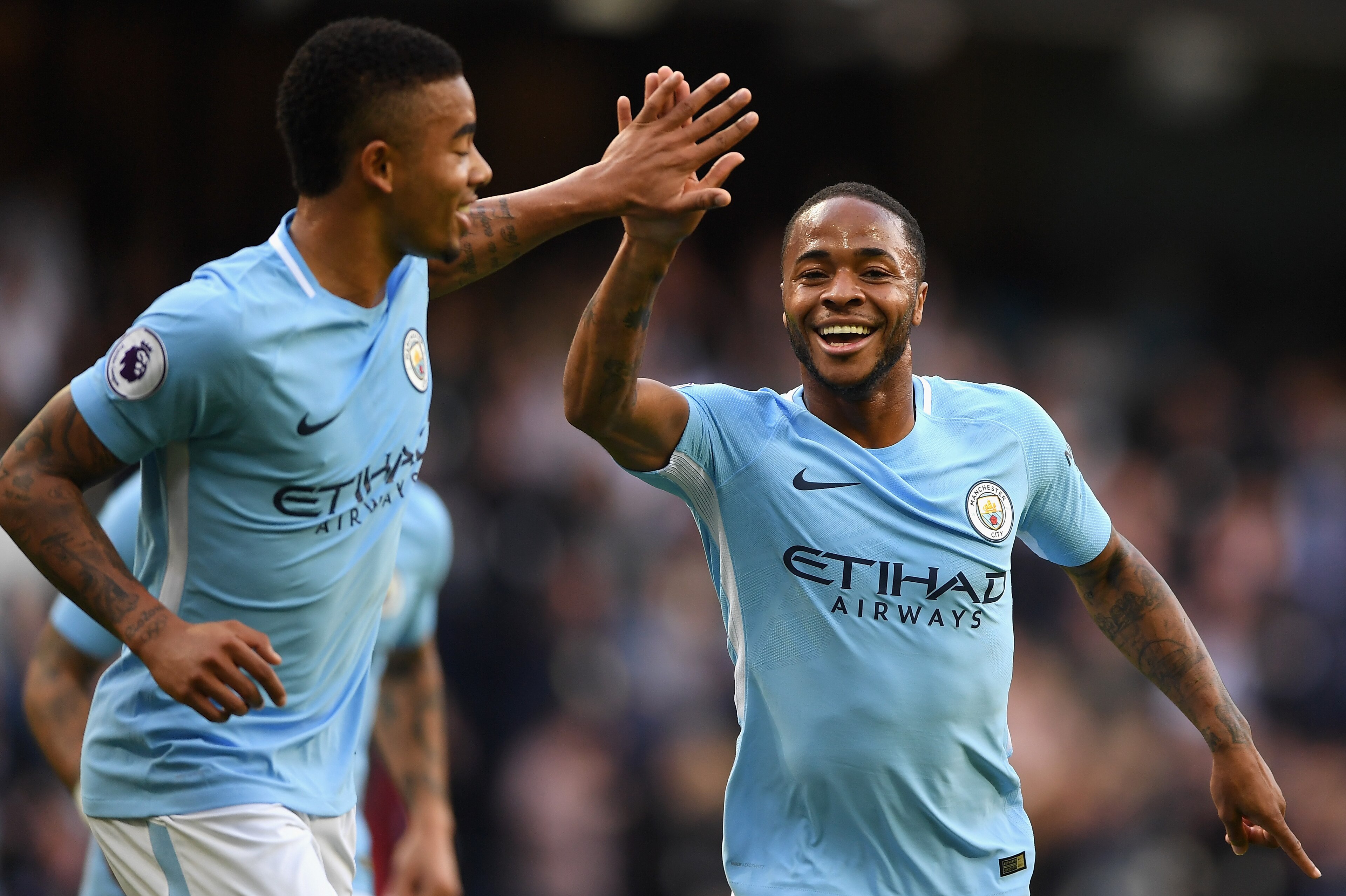 MANCHESTER, ENGLAND - OCTOBER 14: Raheem Sterling of Manchester City celebrates scoring his sides second goal with Gabriel Jesus of Manchester City during the Premier League match between Manchester City and Stoke City at Etihad Stadium on October 14, 201