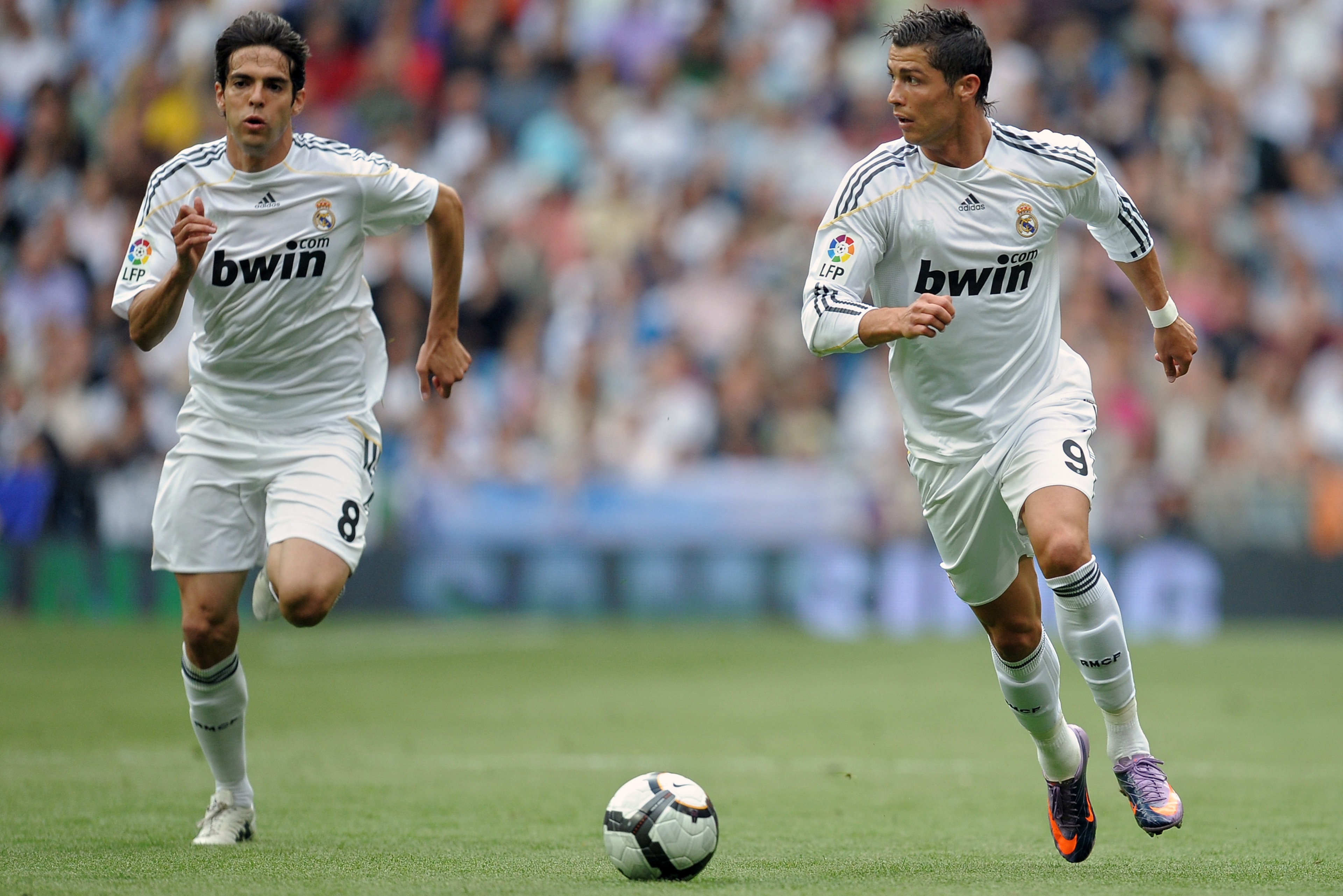 MADRID, SPAIN - MAY 02:  Cristiano Ronaldo (R) of Real Madrid runs with the ball flanked by his teammate Kaka during the La Liga match between Real Madrid and Osasuna at the Estadio Santiago Bernabeu on May 2, 2010 in Madrid, Spain. Real Madrid won the ma