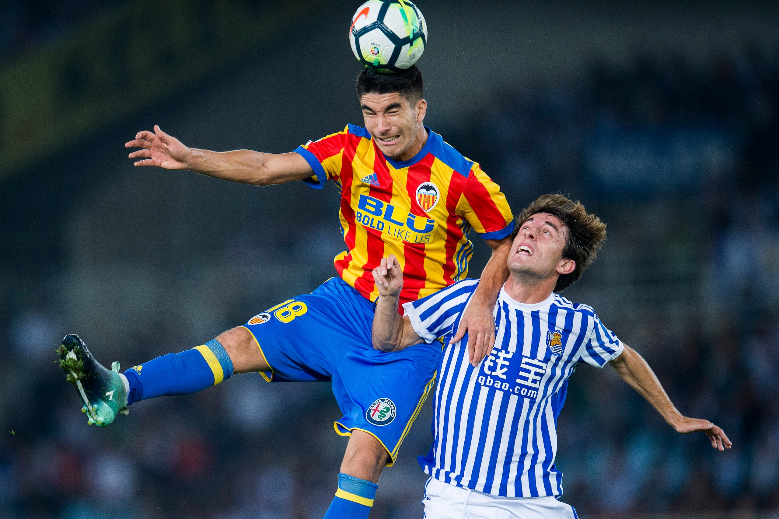 SAN SEBASTIAN, SPAIN - SEPTEMBER 24:  Carlos Soler of Valencia CF duels for the ball with Alvaro Odriozola of Real Sociedad during the La Liga match between Real Sociedad de Futbol and Valencia CF at Estadio Anoeta on September 24, 2017 in San Sebastian, 