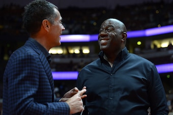 ANAHEIM, CA - SEPTEMBER 30:  Rob Pelinka, general manager of the Los Angeles Lakers talks to Earvin Magic Johnson, president of basketball operations of the Lakers before the game against the Minnesota Timberwolves on September 30, 2017 at the Honda Cente