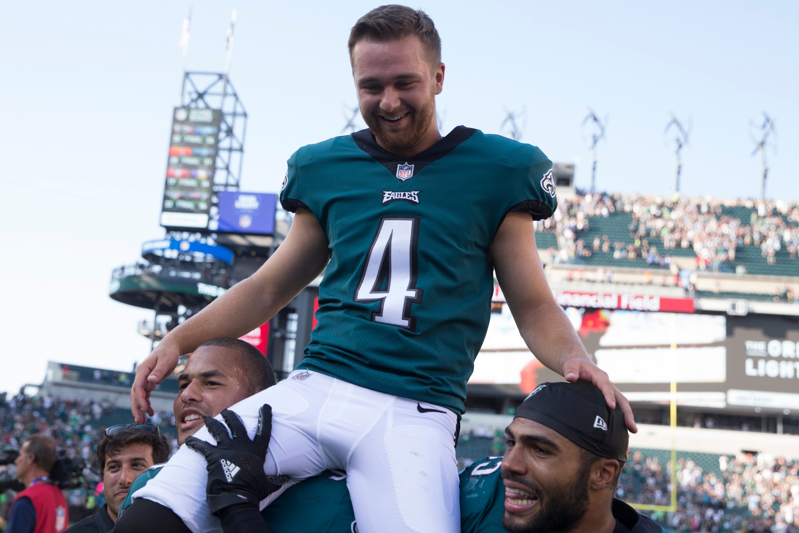 PHILADELPHIA, PA - SEPTEMBER 24: Kamu Grugier-Hill #54 and Mychal Kendricks #95 of the Philadelphia Eagles carry Jake Elliott #4 of the Philadelphia Eagles off the field after the game against the New York Giants at Lincoln Financial Field on September 24