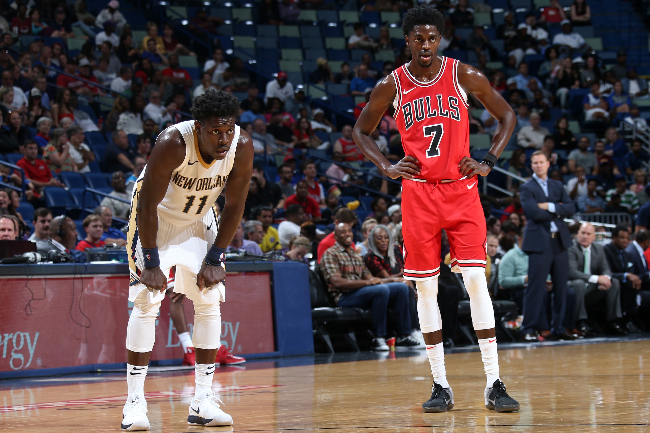 NEW ORLEANS, LA - OCTOBER 3:  Jrue Holiday #11 of the New Orleans Pelicans and Justin Holiday #7 of the Chicago Bulls look on during a preseason game on October 3, 2017 at the Smoothie King Center in New Orleans, Louisiana. NOTE TO USER: User expressly ac