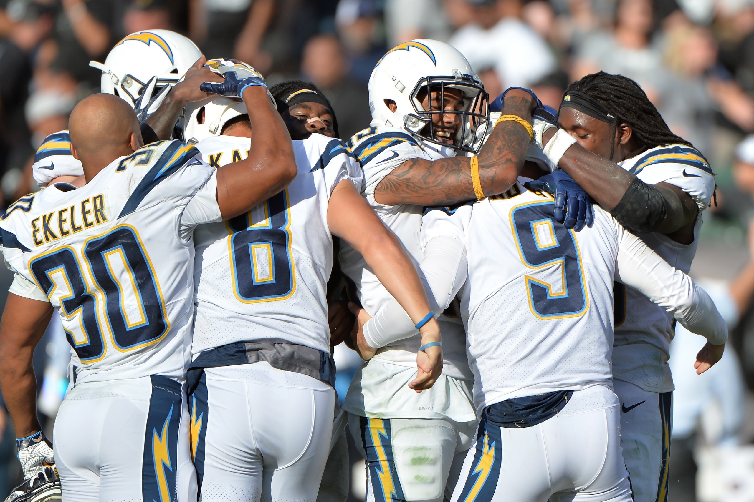 OAKLAND, CA - OCTOBER 15:  Nick Novak #9 of the Los Angeles Chargers celebrates with teammates after kicking the game winning field goal as time expires in their NFL game against the Oakland Raiders at Oakland-Alameda County Coliseum on October 15, 2017 i