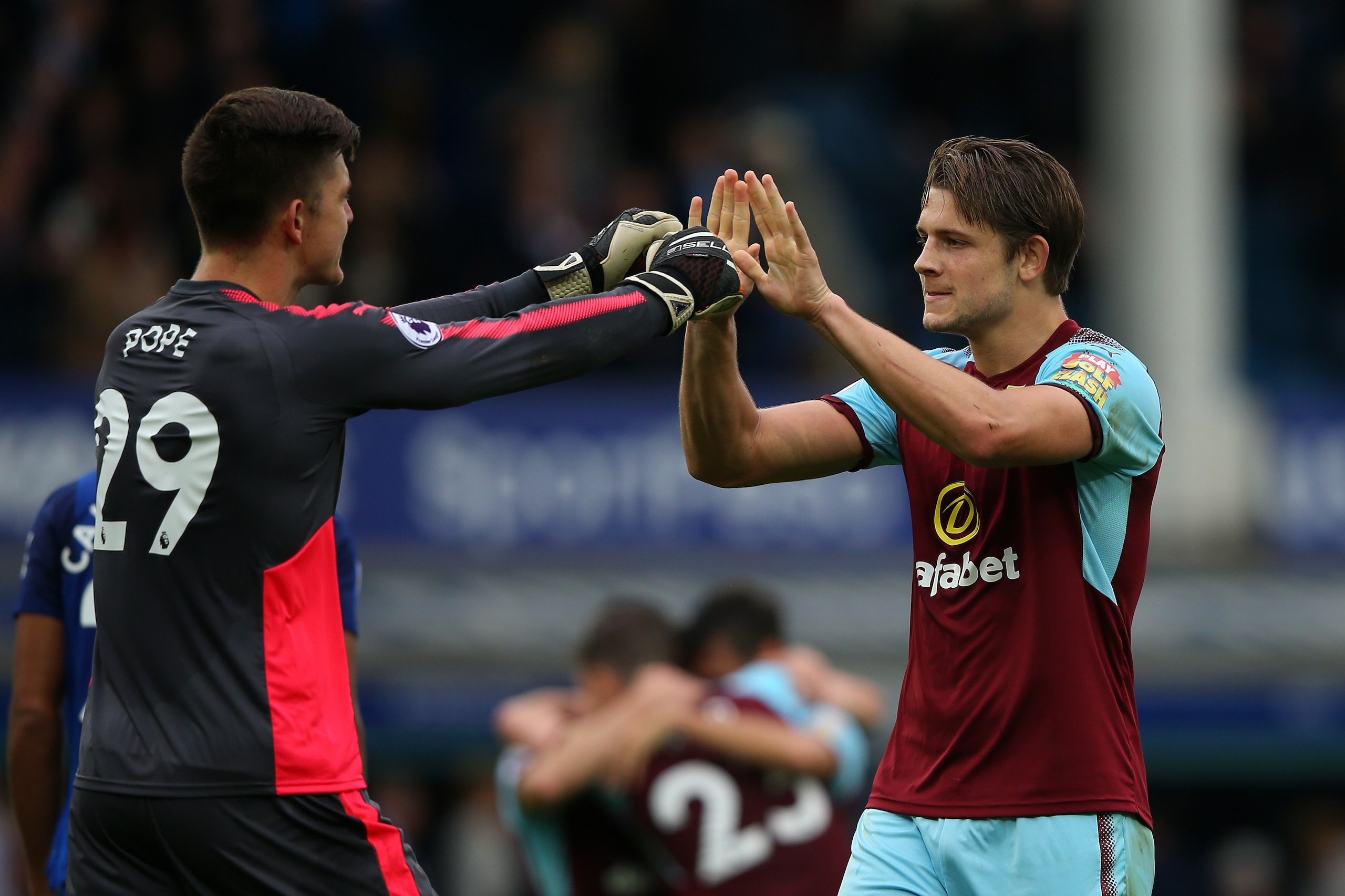 LIVERPOOL, ENGLAND - OCTOBER 01: Nick Pope of Burnley and James Tarkowski of Burnley celebrate victory together after the Premier League match between Everton and Burnley at Goodison Park on October 1, 2017 in Liverpool, England.  (Photo by Alex Livesey/G