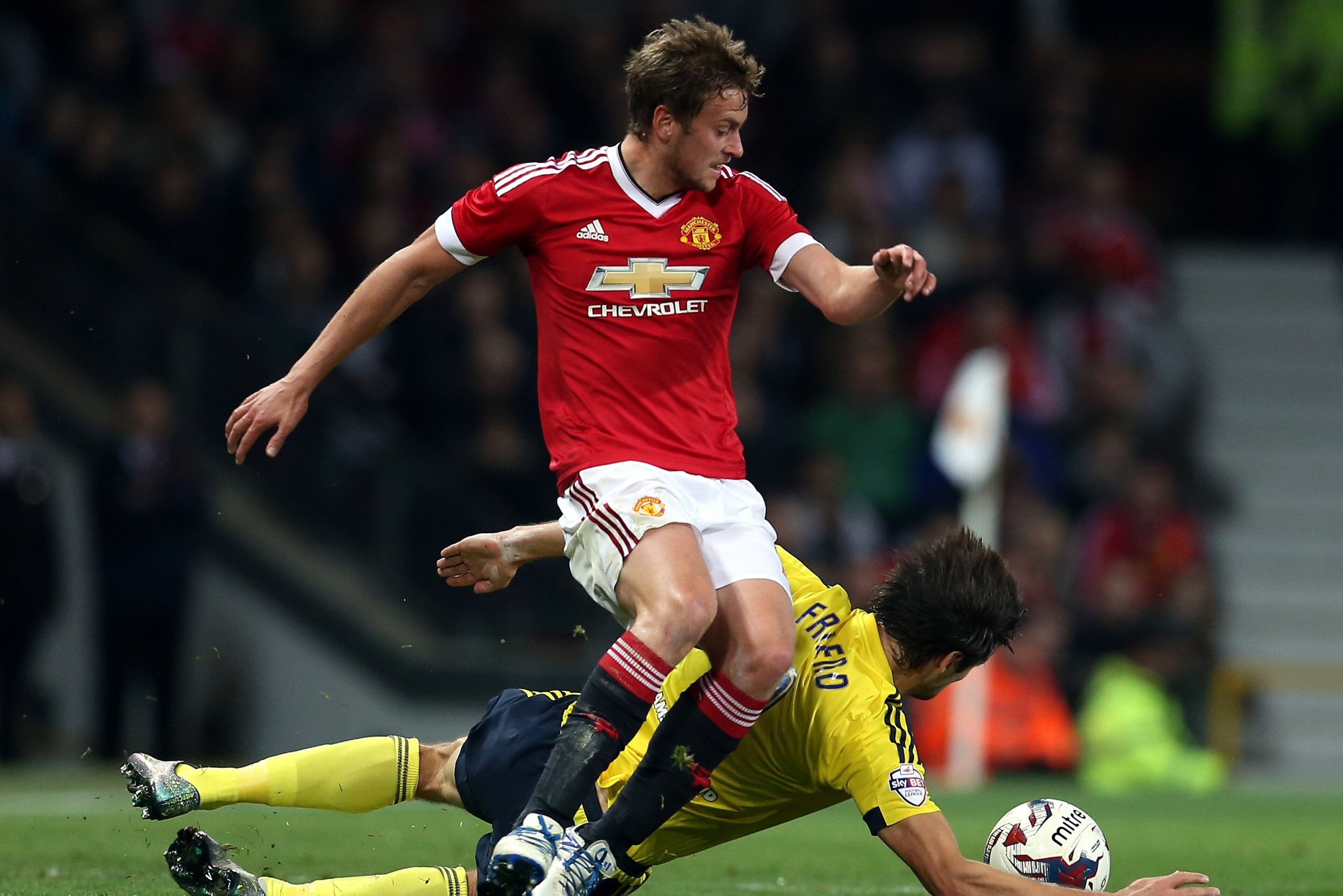 Manchester United's English striker James Wilson (L) vies with Middlesbrough's English defender George Friend during the English League Cup fourth round football match between Manchester United and Middlesbrough at Old Trafford in Manchester, north west E