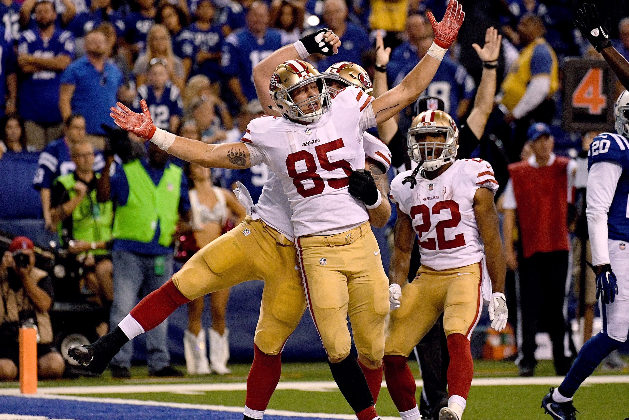 INDIANAPOLIS, IN - OCTOBER 08: George Kittle #85 of the San Francisco 49ers celebrates after scoring a game tying touchdown in the fourth quarter during the game between the Indianapolis Colts and the San Francisco 49ers at Lucas Oil Stadium on October 8,