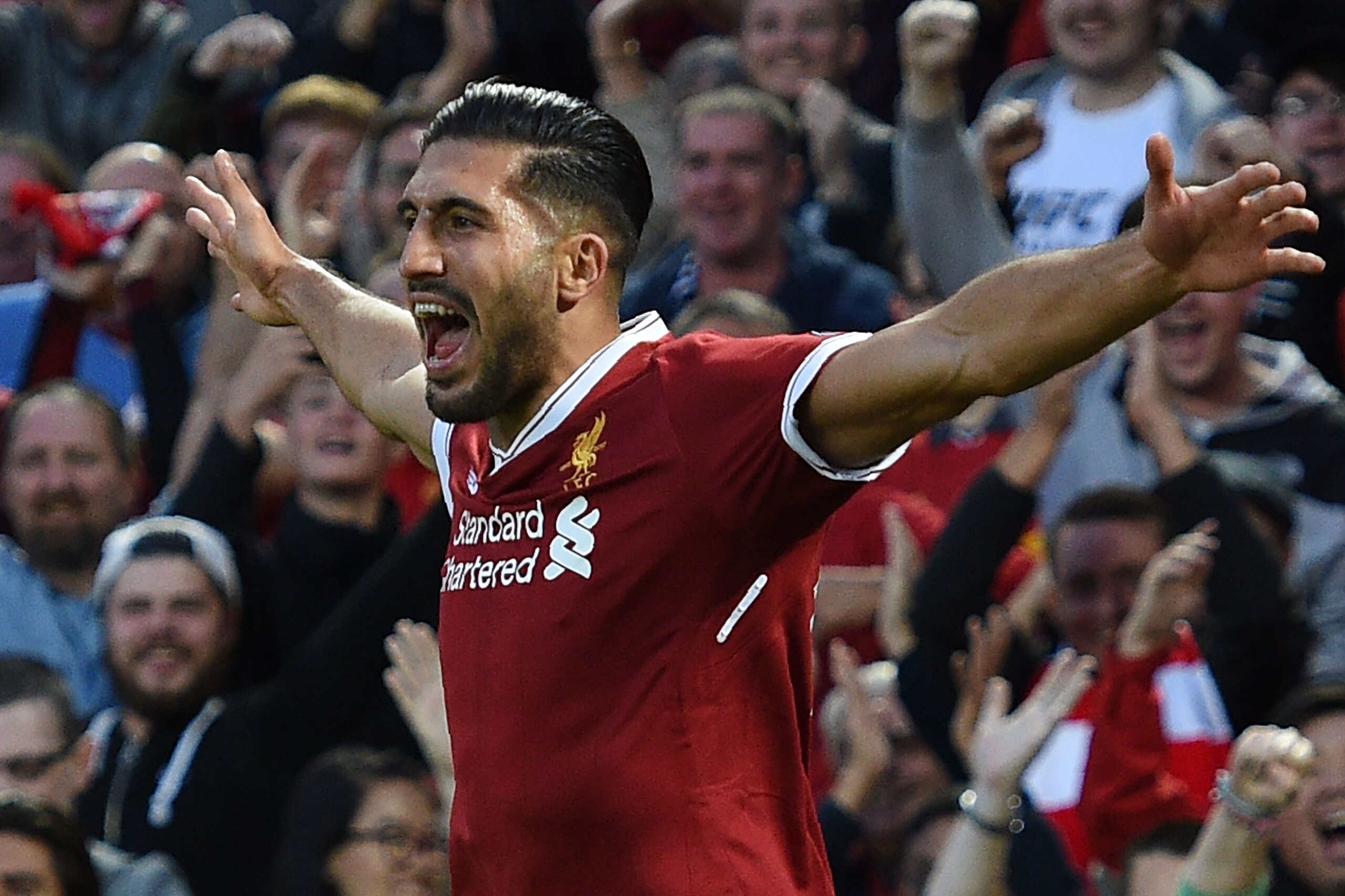 Liverpool's German midfielder Emre Can celebrates scoring the team's first goal during the Champions League qualifier, second leg match between Liverpool and Hoffenheim at Anfield stadium in Liverpool on August 23, 2017. / AFP PHOTO / Oli SCARFF        (P