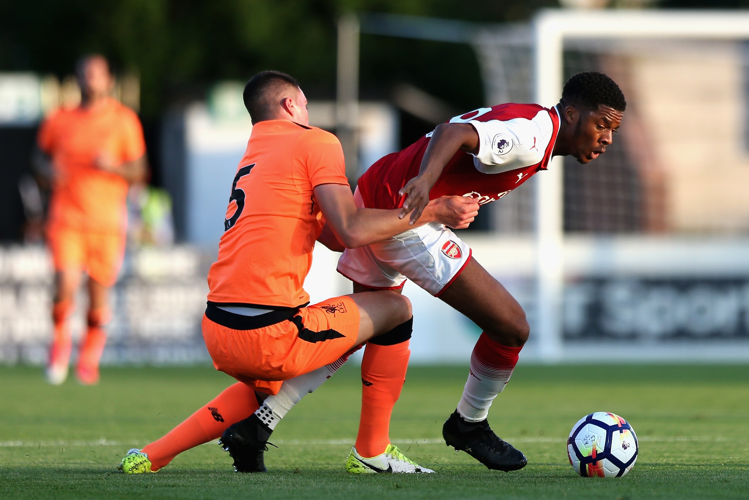 BOREHAMWOOD, ENGLAND - AUGUST 25: Mich'el Parker of Liverpool pulls down Chuba Akpom of Arsenal  during the Premier League 2 match between Arsenal and Liverpool at Meadow Park on August 25, 2017 in Borehamwood, England.  (Photo by Alex Pantling/Getty Imag