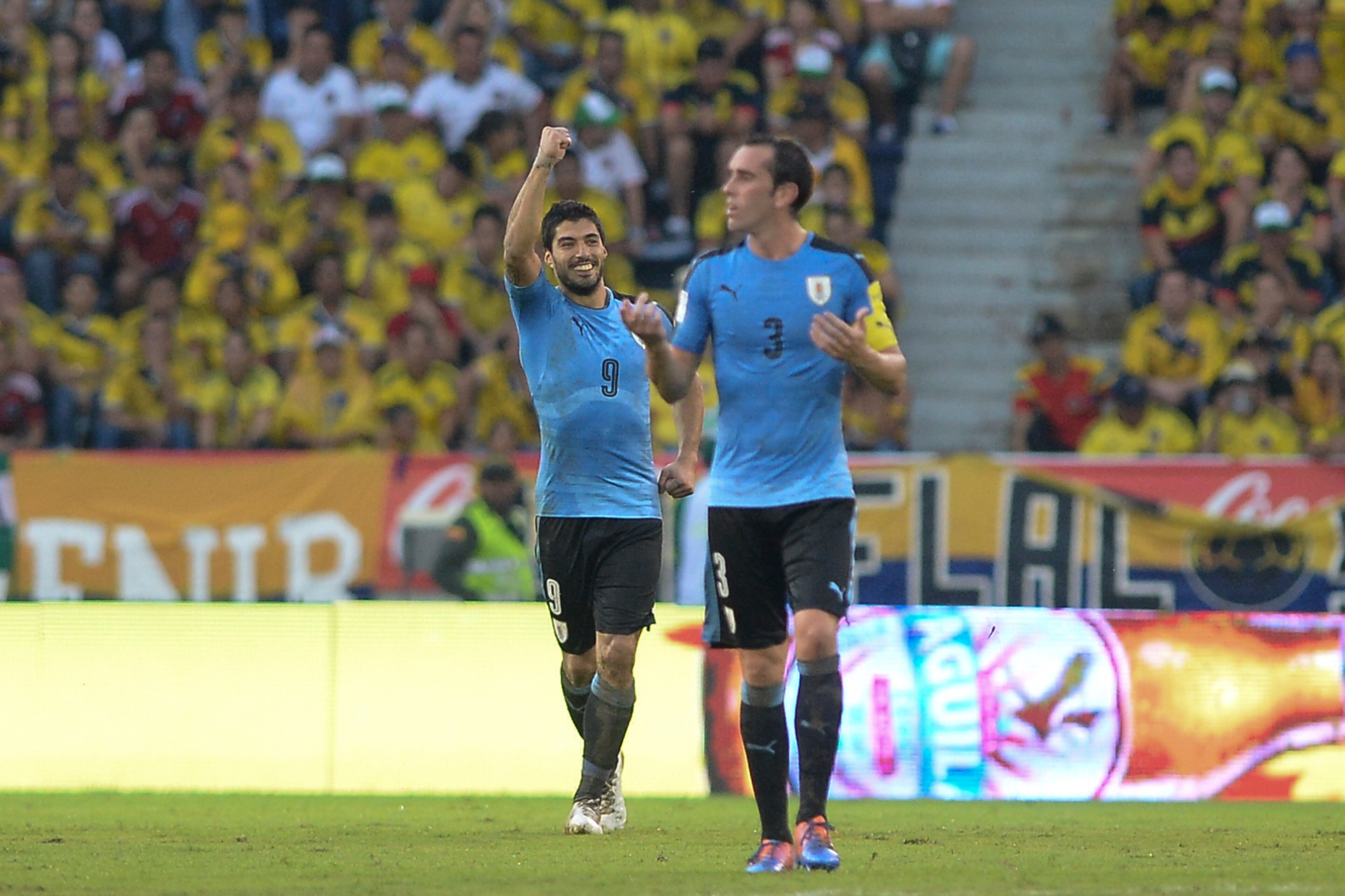 Uruguay's Luis Suarez (L) celebrates next to Uruguay's Diego Godin after scoring against Colombia during their Russia 2018 World Cup football qualifier match in Barranquilla, Colombia, on October 11, 2016. / AFP / Raul Arboleda (Photo credit should Uruguay's Luis Suarez (L) celebrates next to Uruguay's Diego Godin after scoring against Colombia during their Russia 2018 World Cup football qualifier match in Barranquilla, Colombia, on October 11, 2016. / AFP / Raul Arboleda (Photo credit should