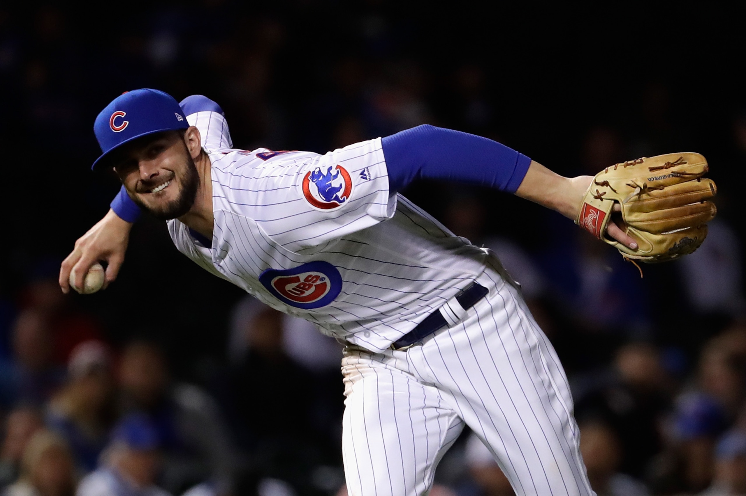 CHICAGO, IL - OCTOBER 17:  Kris Bryant #17 of the Chicago Cubs throws to first base in the ninth inning against the Los Angeles Dodgers during game three of the National League Championship Series at Wrigley Field on October 17, 2017 in Chicago, Illinois.