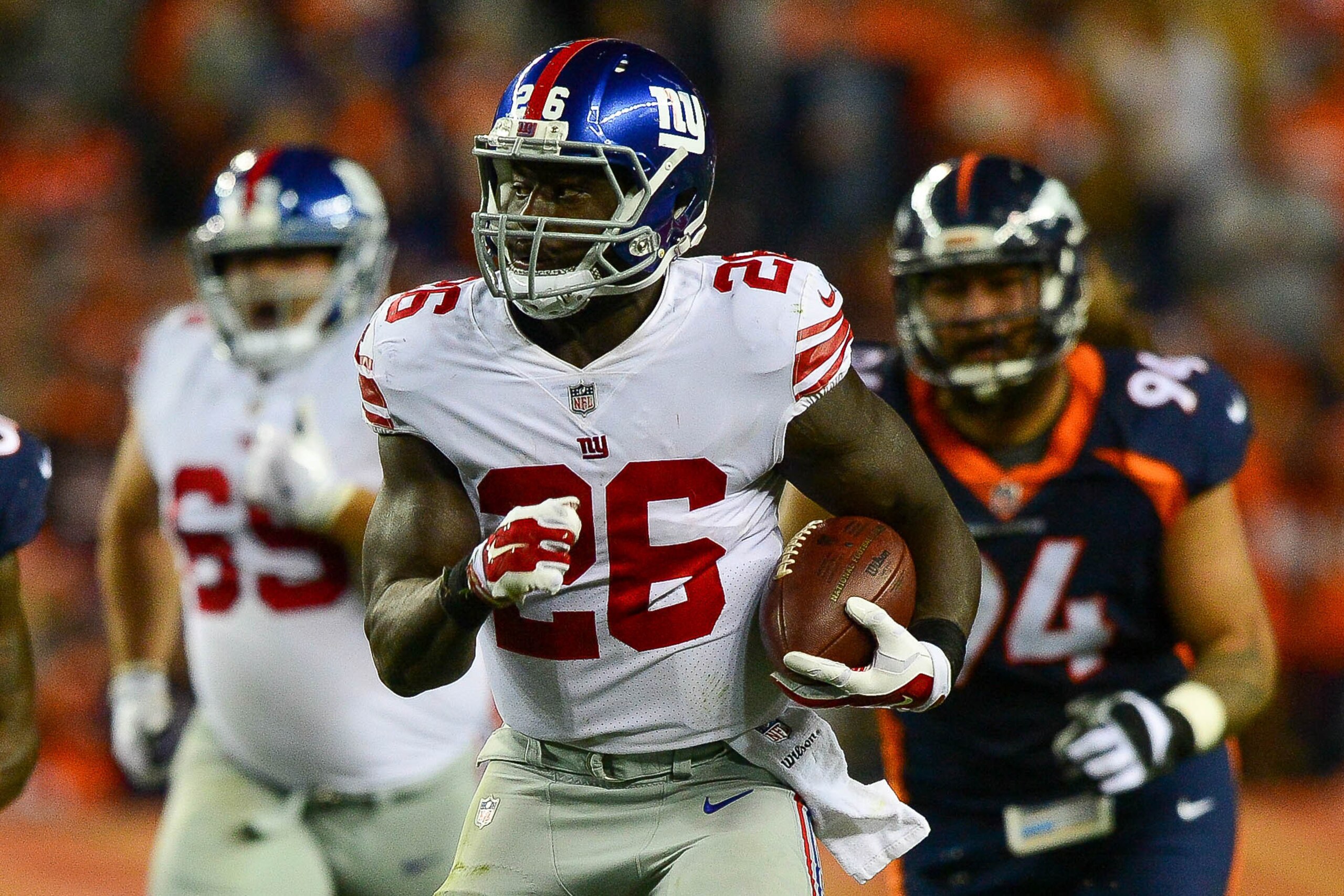 DENVER, CO - OCTOBER 15:  Running back Orleans Darkwa #26 of the New York Giants breaks out for a long run against the Denver Broncos in the second quarter of a game at Sports Authority Field at Mile High on October 15, 2017 in Denver, Colorado. (Photo by