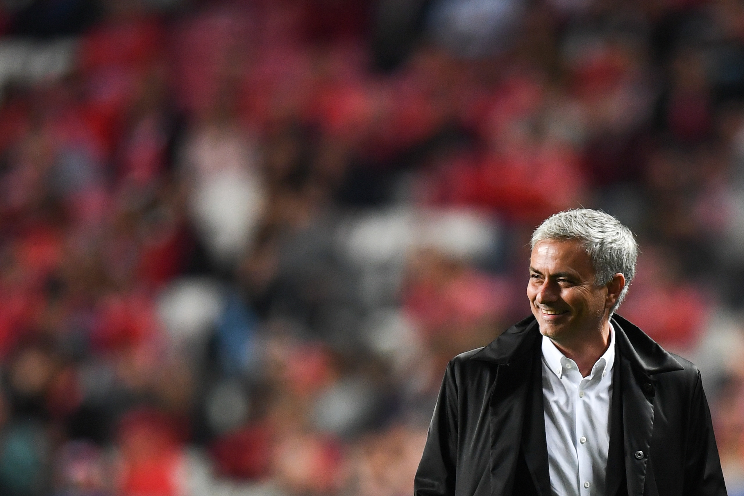 Manchester United's Portuguese manager Jose Mourinho smiles during the UEFA Champions League group A football match SL Benfica vs Manchester United FC at the Luz stadium in Lisbon on Ocotber 18, 2017. / AFP PHOTO / PATRICIA DE MELO MOREIRA        (Photo c