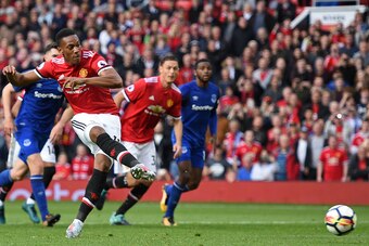 Manchester United's French striker Anthony Martial scores their fourth goal from the penalty spot during the English Premier League football match between Manchester United and Everton at Old Trafford in Manchester, north west England, on September 17, 20