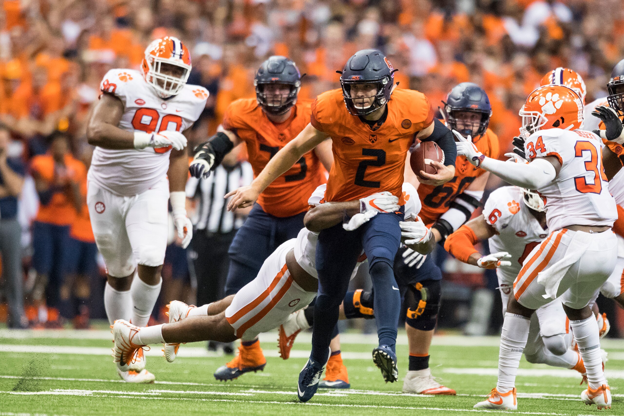 SYRACUSE, NY - OCTOBER 13:  Eric Dungey #2 of the Syracuse Orange runs for a first down in the final minutes of the game against the Clemson Tigers at the Carrier Dome on October 13, 2017 in Syracuse, New York. Syracuse defeats Clemson 27-24.  (Photo by B