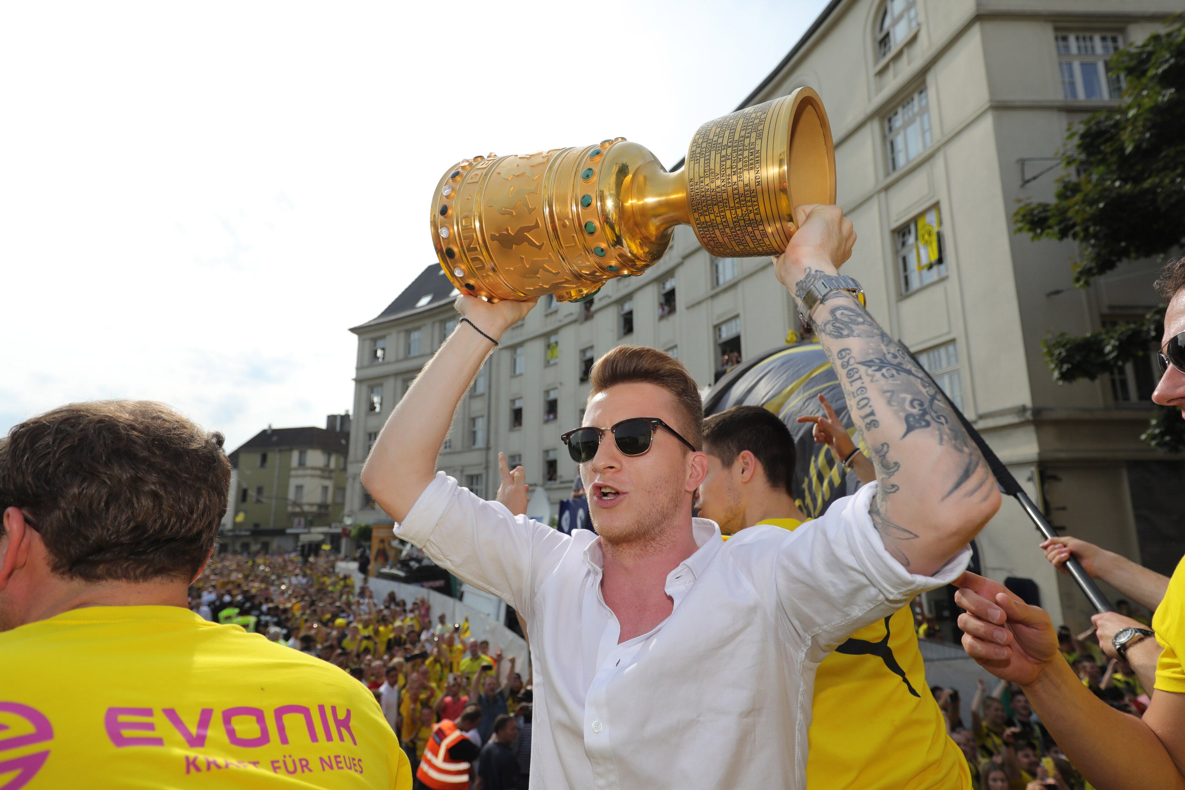 DORTMUND, GERMANY - MAY 28:  Marco Reus of Borussia Dortmund lifts the DFB Cup trophy as the team celebrates during a winner's parade at Borsigplatz on May 28, 2017 in Dortmund, Germany.  (Photo by Pool - Getty Images)
